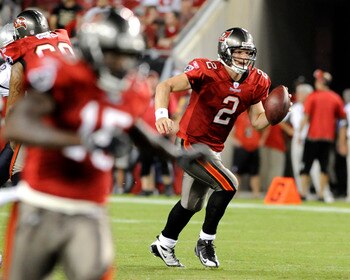 TAMPA, FL - AUGUST 17: Quarterback Chris Simms #2 of the Tampa Bay Buccaneers scrambles from the pocket against the New England Patriots at Raymond James Stadium on August 17, 2008 in Tampa, Florida.   (Photo by Al Messerschmidt/Getty Images)