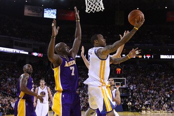 OAKLAND, CA - JANUARY 12: Monta Ellis #8 of the Golden State Warriors goes up for a shot on Lamar Odom #7 of the Los Angeles Lakers at Oracle Arena on January 12, 2011 in Oakland, California. NOTE TO USER: User expressly acknowledges and agrees that, by d