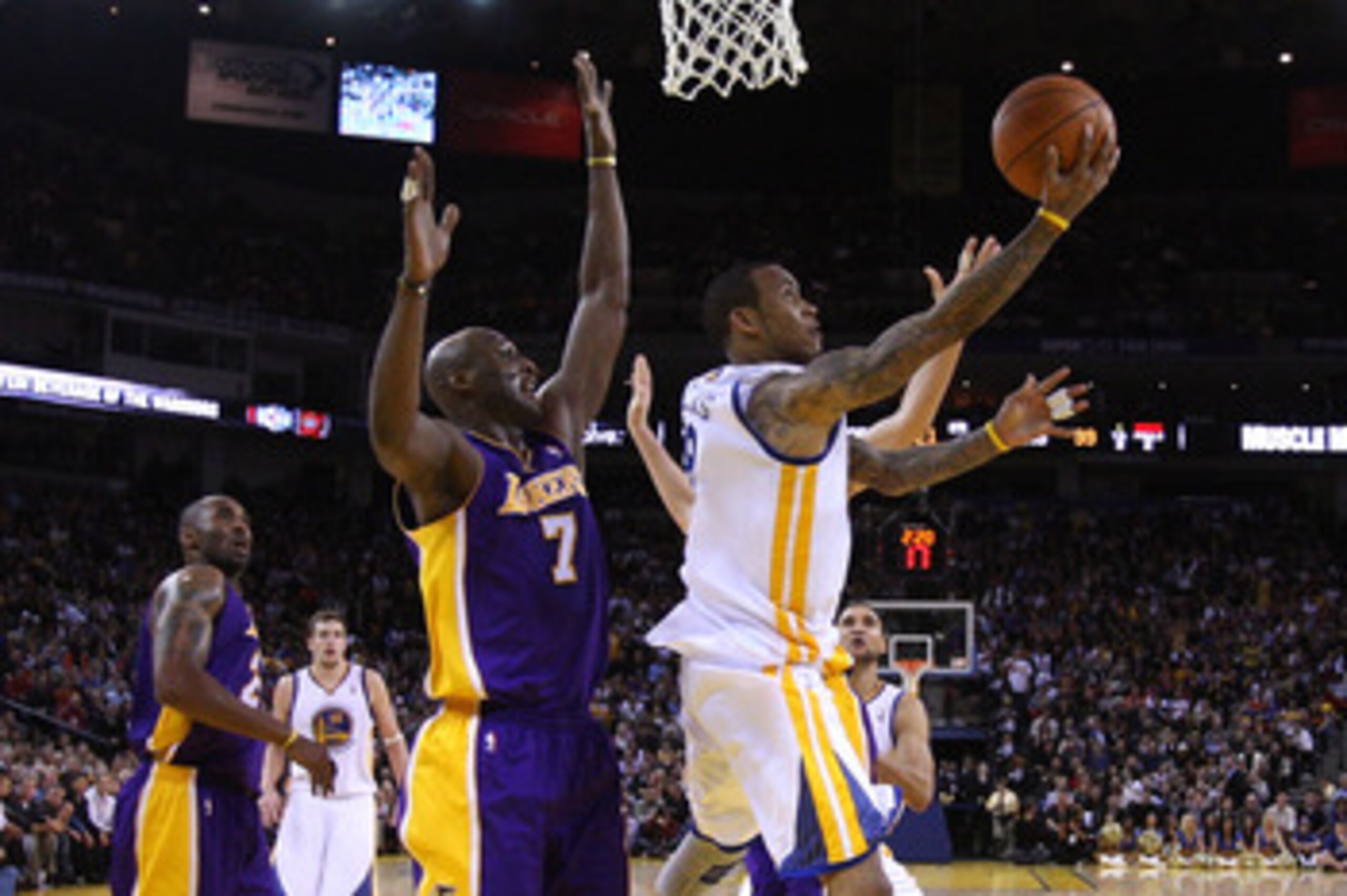 OAKLAND, CA - JANUARY 12: Monta Ellis #8 of the Golden State Warriors goes up for a shot on Lamar Odom #7 of the Los Angeles Lakers at Oracle Arena on January 12, 2011 in Oakland, California. NOTE TO USER: User expressly acknowledges and agrees that, by d