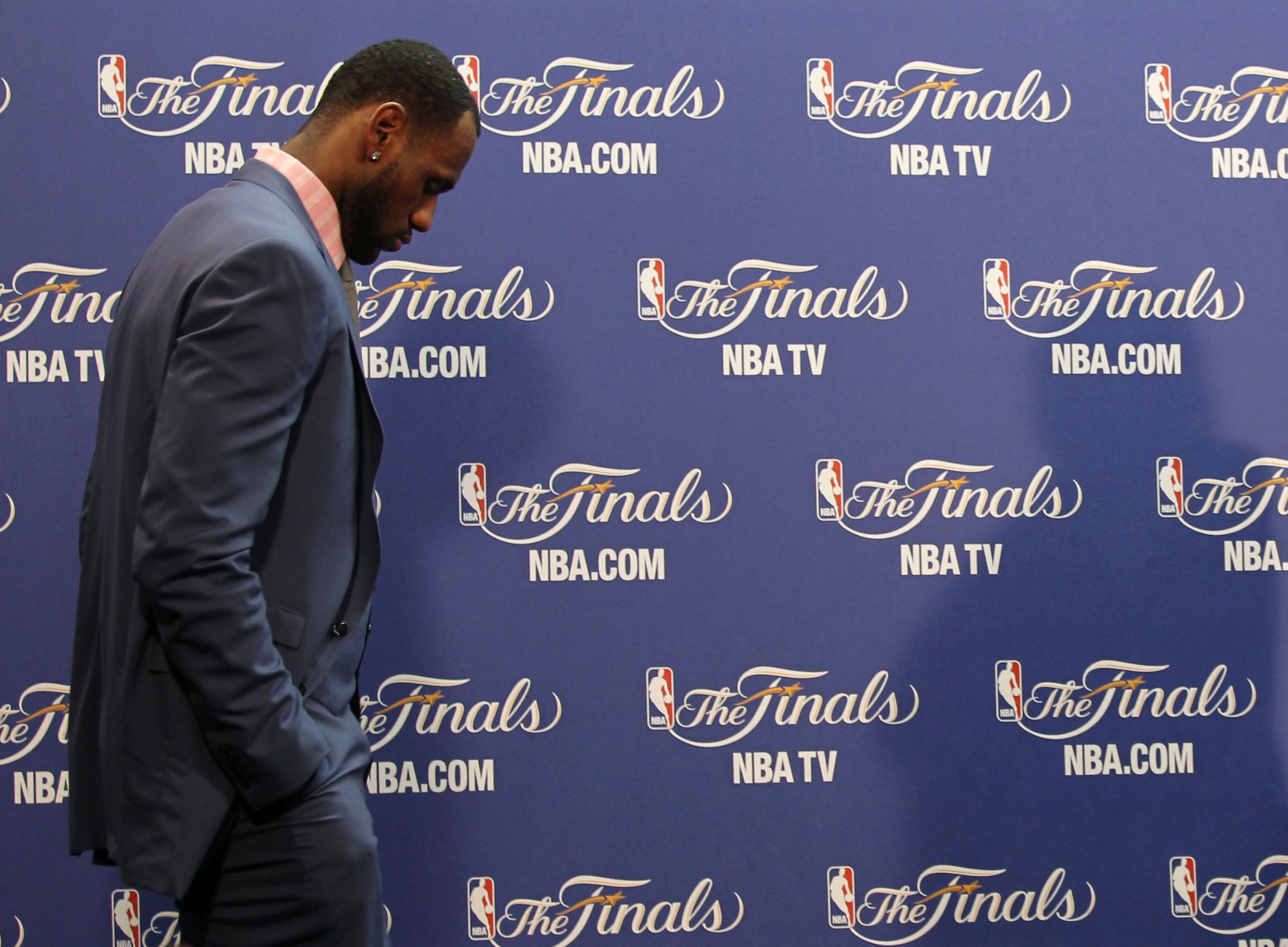 MIAMI, FL - JUNE 12:  LeBron James #6 of the Miami Heat walks into the interview room to answer questions after the Heat were defeated 105-95 by the Dallas Mavericks in Game Six of the 2011 NBA Finals at American Airlines Arena on June 12, 2011 in Miami, 