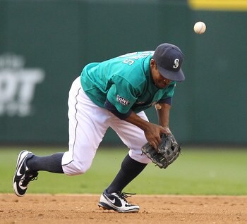 SEATTLE - JUNE 13:  Third baseman Chone Figgins #9 of the Seattle Mariners misplays this grounder by Jeff Mathis #5 of the Los Angeles Angels of Anaheim at Safeco Field on June 13, 2011 in Seattle, Washington. Figgins was charged with an error on the play