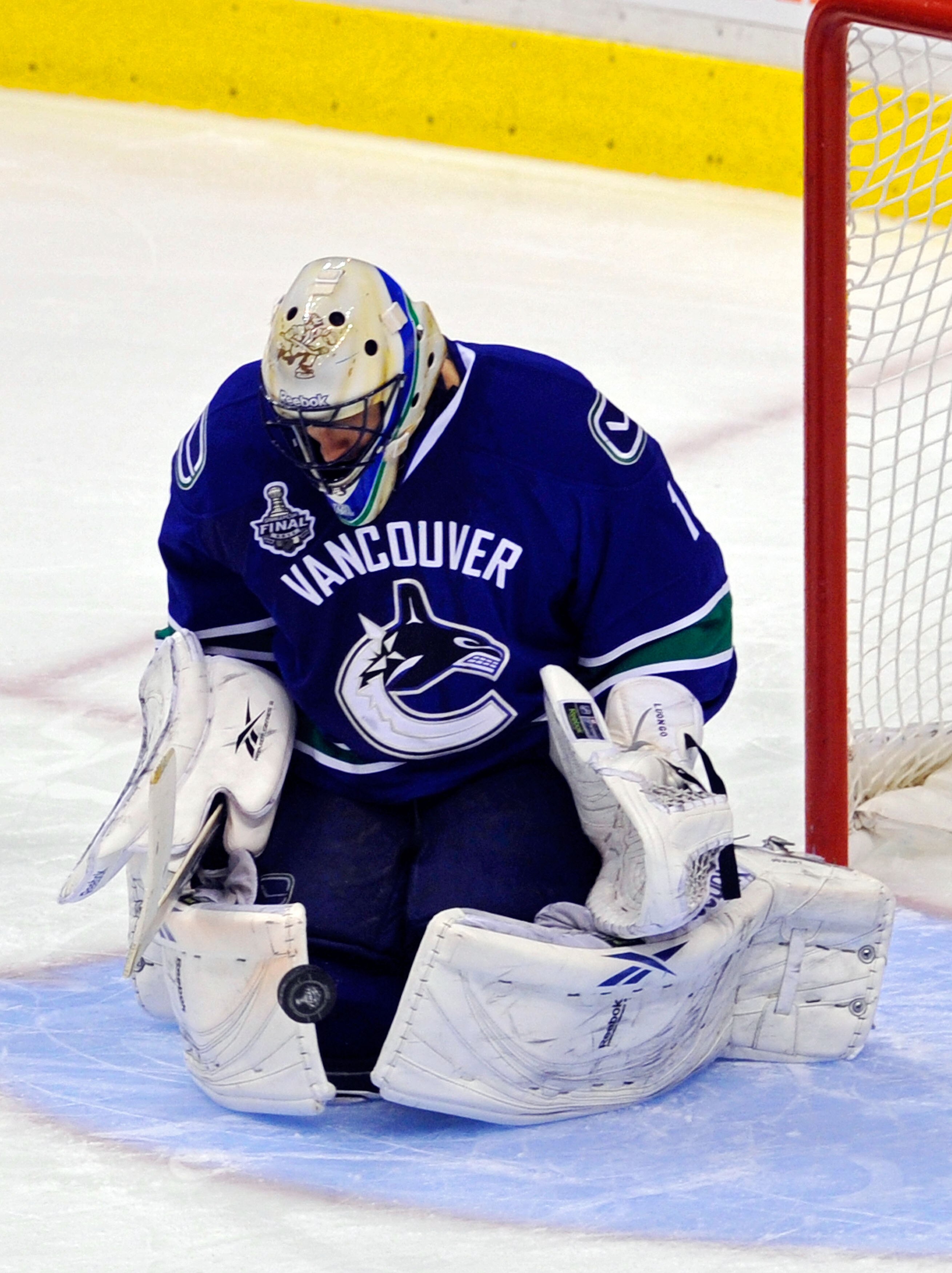 VANCOUVER, BC - JUNE 10:  Roberto Luongo #1 of the Vancouver Canucks makes a glove save against the Boston Bruins during Game Five of the 2011 NHL Stanley Cup Final at Rogers Arena on June 10, 2011 in Vancouver, British Columbia, Canada.  (Photo by Rich L