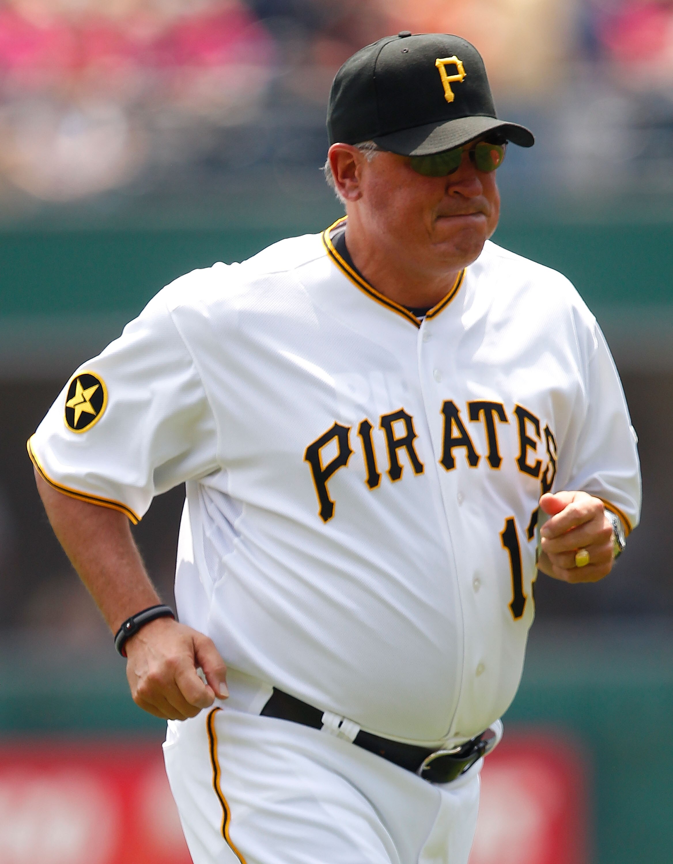 PITTSBURGH - MAY 25:  Manager Clint Hurdle #13 of the Pittsburgh Pirates jogs back to the dugout during the game against the Atlanta Braves on May 25, 2011 at PNC Park in Pittsburgh, Pennsylvania.  (Photo by Jared Wickerham/Getty Images)
