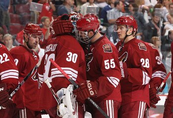 GLENDALE, AZ - APRIL 20:  Ed Jovanovski #55 of the Phoenix Coyotes talks with goaltender Ilya Bryzgalov #30 after being defeated by the Detroit Red Wings in Game Four of the Western Conference Quarterfinals during the 2011 NHL Stanley Cup Playoffs at Jobi