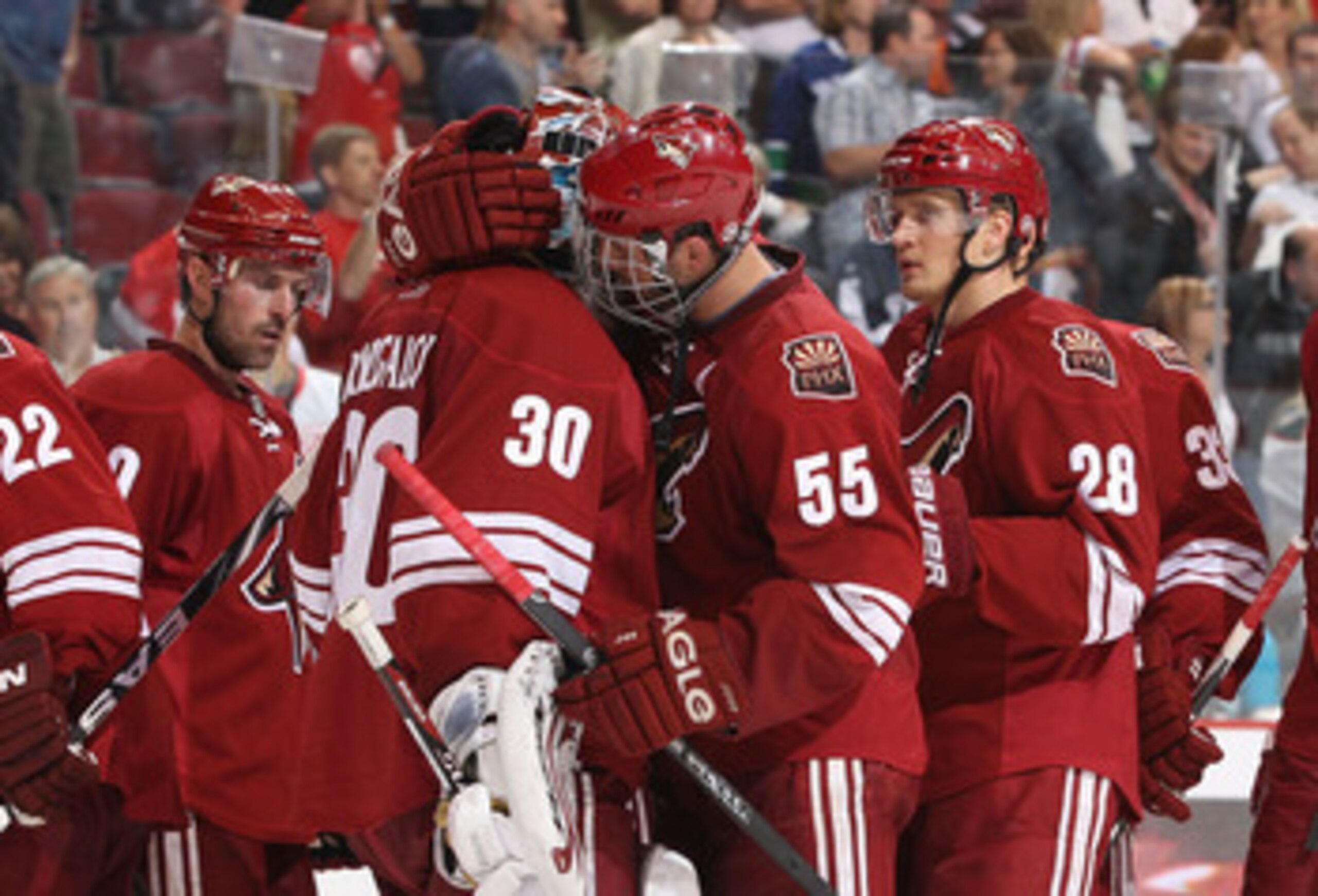 GLENDALE, AZ - APRIL 20:  Ed Jovanovski #55 of the Phoenix Coyotes talks with goaltender Ilya Bryzgalov #30 after being defeated by the Detroit Red Wings in Game Four of the Western Conference Quarterfinals during the 2011 NHL Stanley Cup Playoffs at Jobi