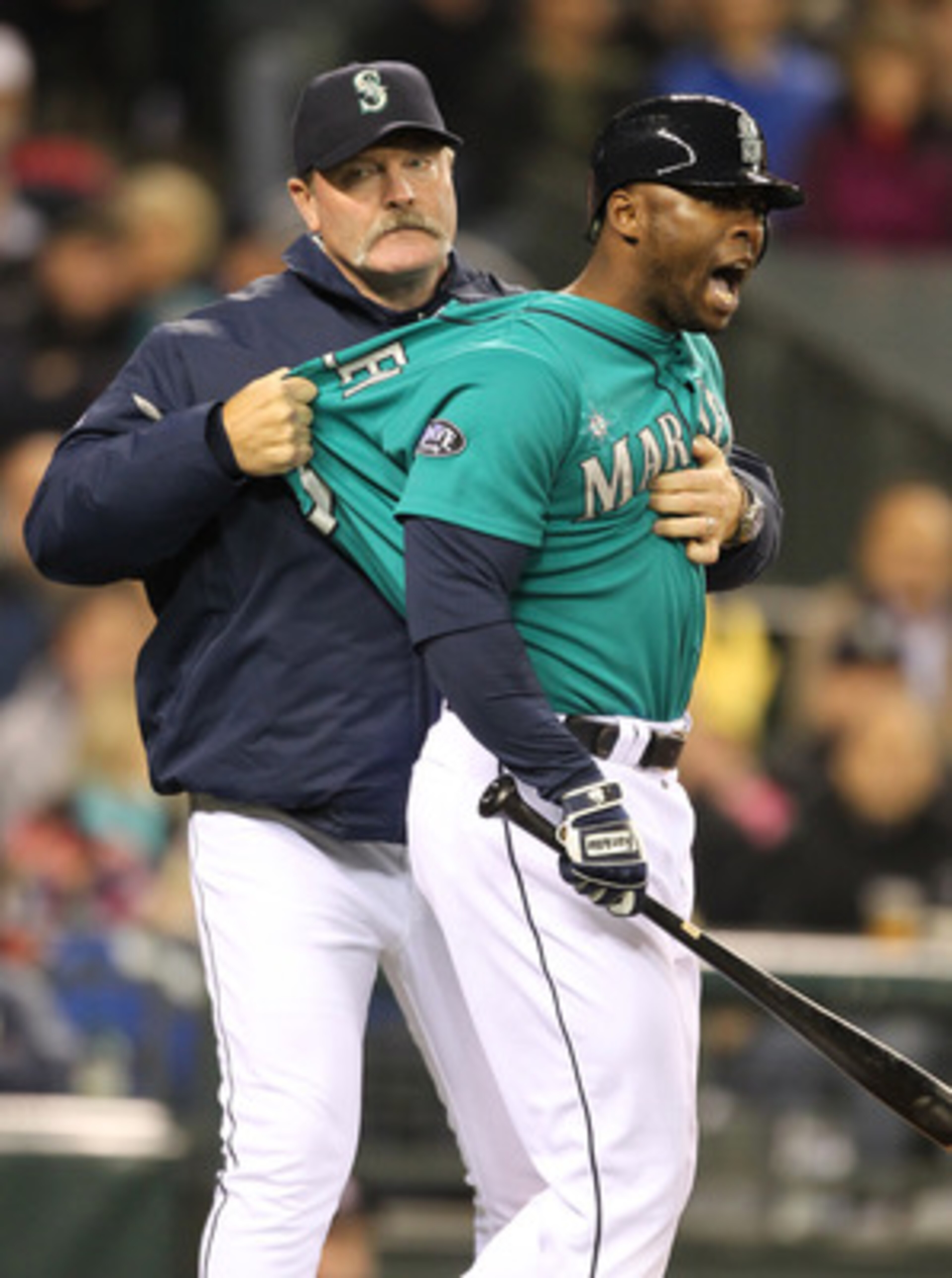 SEATTLE - FILE: Milton Bradley #15 of the Seattle Mariners is restrained by manager Eric Wedge #22 after being ejected from the game against the Chicago White Sox at Safeco Field on May 6, 2011 in Seattle, Washington. According to reports May 9, 201, Bra SEATTLE - FILE: Milton Bradley #15 of the Seattle Mariners is restrained by manager Eric Wedge #22 after being ejected from the game against the Chicago White Sox at Safeco Field on May 6, 2011 in Seattle, Washington. According to reports May 9, 201, Bra