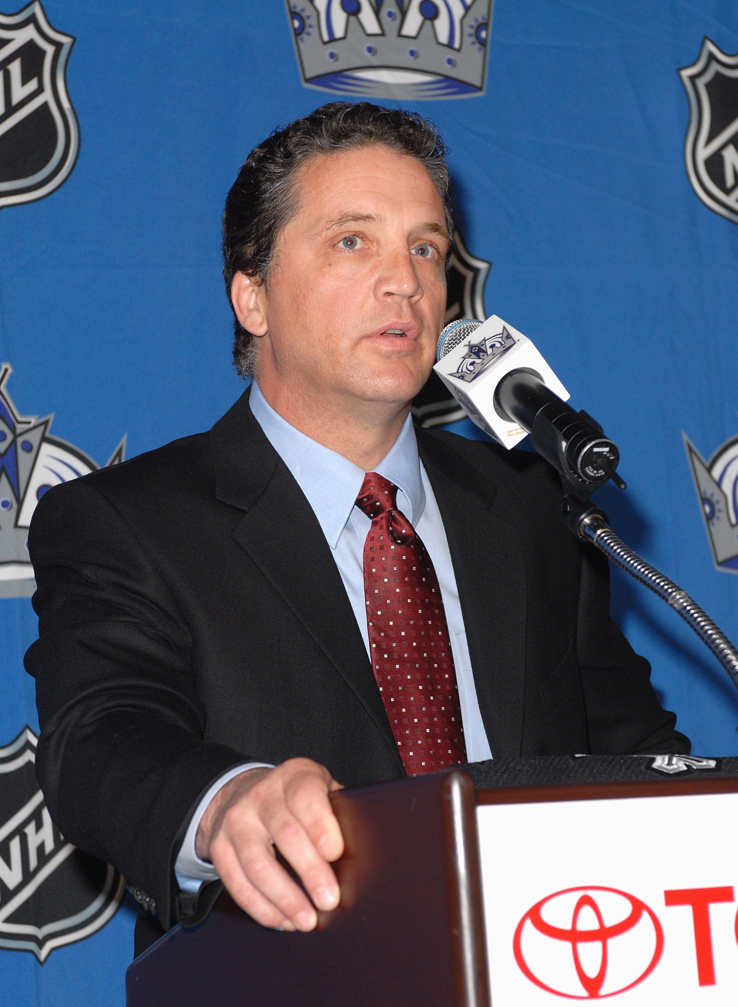 EL SEGUNDO, CA - JULY 5: General Manager Dean Lombardi of the Los Angeles Kings speaks to the media during the press announcement that former Los Angeles Kings defenseman Rob Blake has agreed to a two-year contract with the team on July 5, 2006 at the To EL SEGUNDO, CA - JULY 5: General Manager Dean Lombardi of the Los Angeles Kings speaks to the media during the press announcement that former Los Angeles Kings defenseman Rob Blake has agreed to a two-year contract with the team on July 5, 2006 at the To