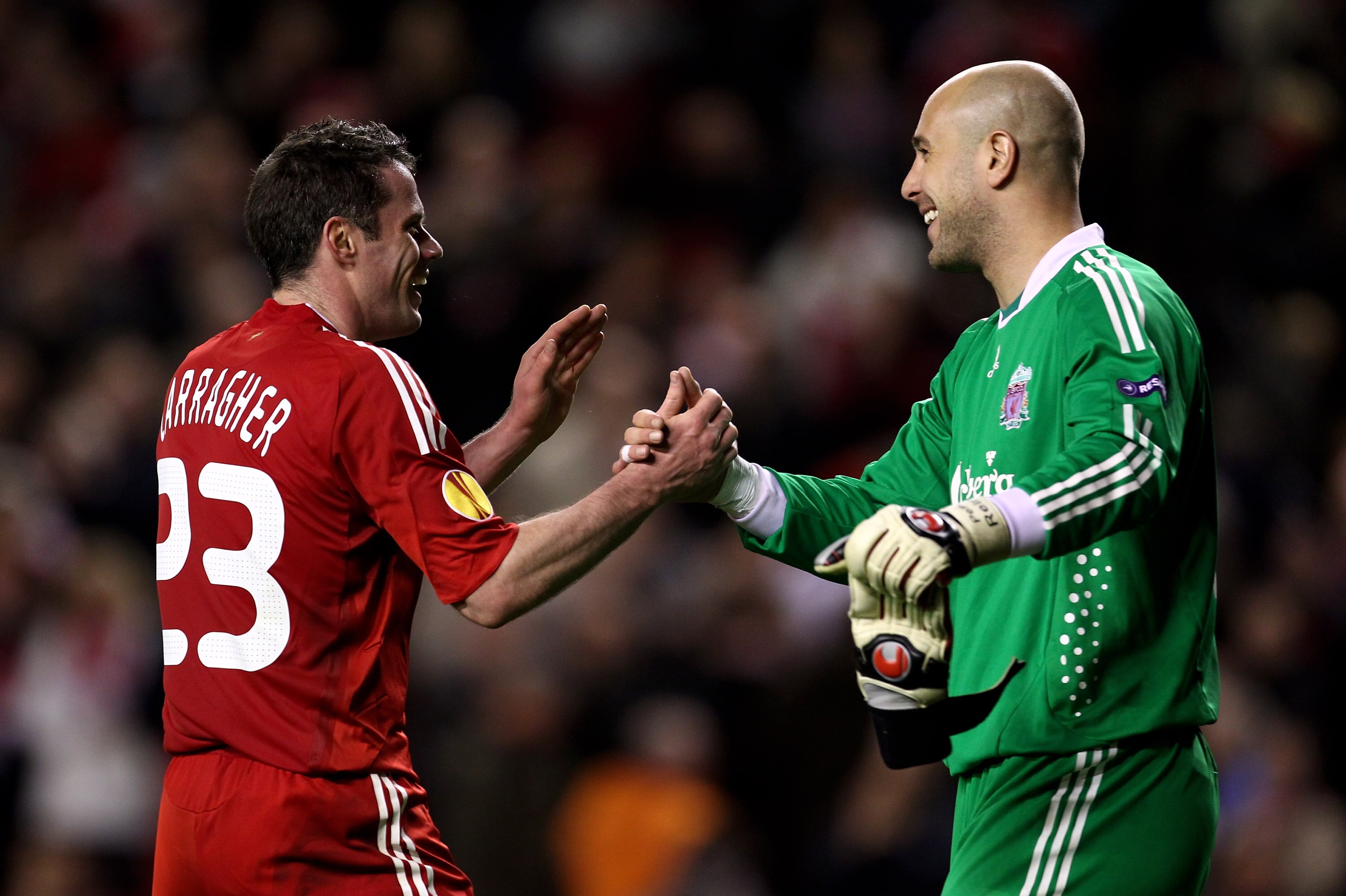 LIVERPOOL, ENGLAND - MARCH 18:  Pepe Reina of Liverpool celebrates with team mate Jamie Carragher (L) at the end of the UEFA Europa League Round of 16, second leg match at Anfield on March 18, 2010 in Liverpool, England.  (Photo by Alex Livesey/Getty Imag