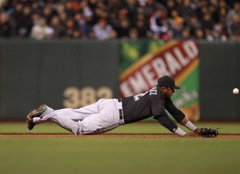SAN FRANCISCO, CA - MAY 24:  Hanley Ramirez #2 of the Florida Marlins can't stop a ball hit by Freddy Sanchez #21 of the San Francisco Giants at AT&T Park on May 24, 2011 in San Francisco, California.  (Photo by Ezra Shaw/Getty Images)