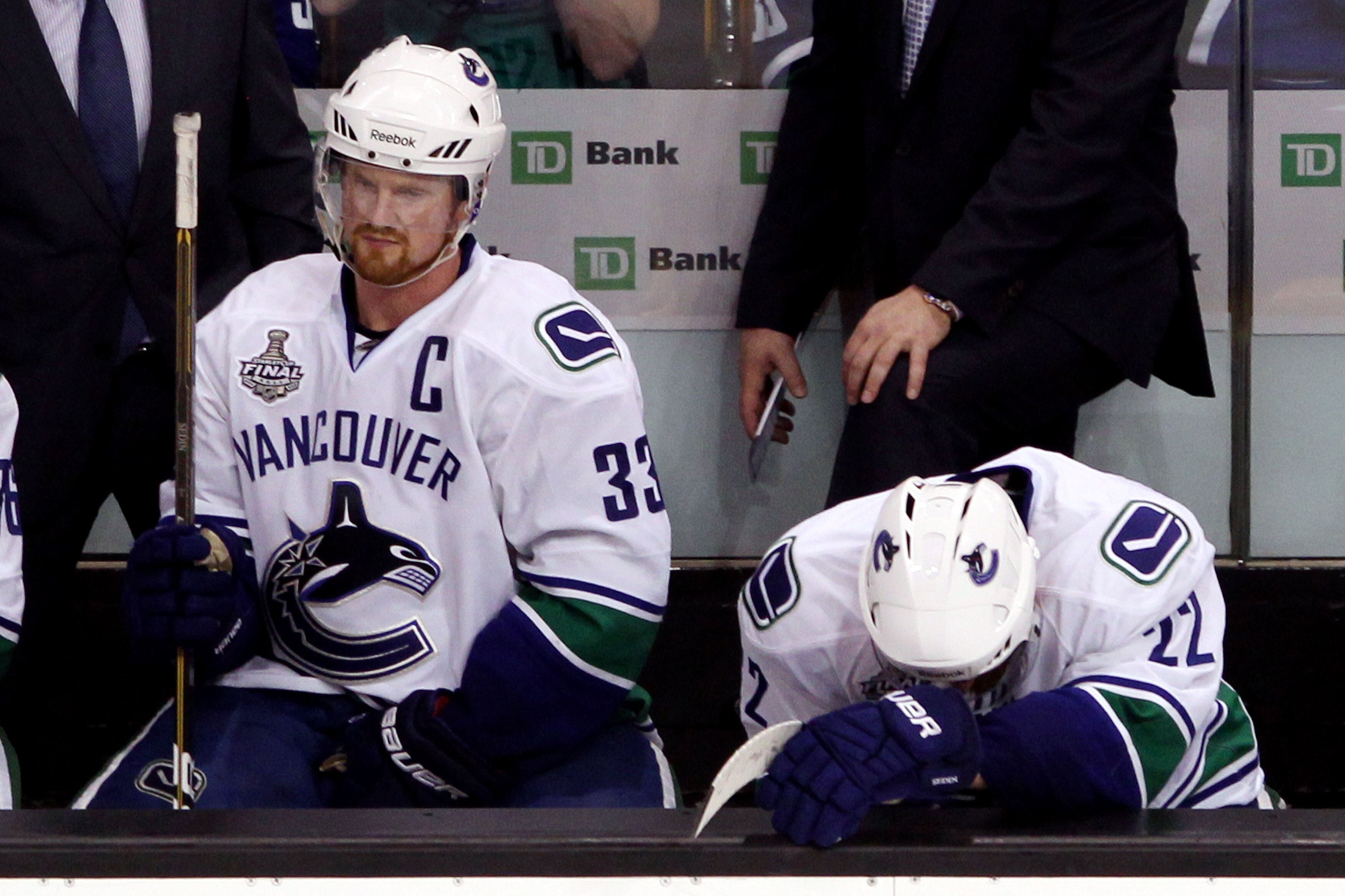 BOSTON, MA - JUNE 13: Henrik Sedin #33 and Daniel Sedin #22 of the Vancouver Canucks sit on the bench during Game Six against the Boston Bruins in the 2011 NHL Stanley Cup Final at TD Garden on June 13, 2011 in Boston, Massachusetts. (Photo by Bruce Ben BOSTON, MA - JUNE 13: Henrik Sedin #33 and Daniel Sedin #22 of the Vancouver Canucks sit on the bench during Game Six against the Boston Bruins in the 2011 NHL Stanley Cup Final at TD Garden on June 13, 2011 in Boston, Massachusetts. (Photo by Bruce Ben
