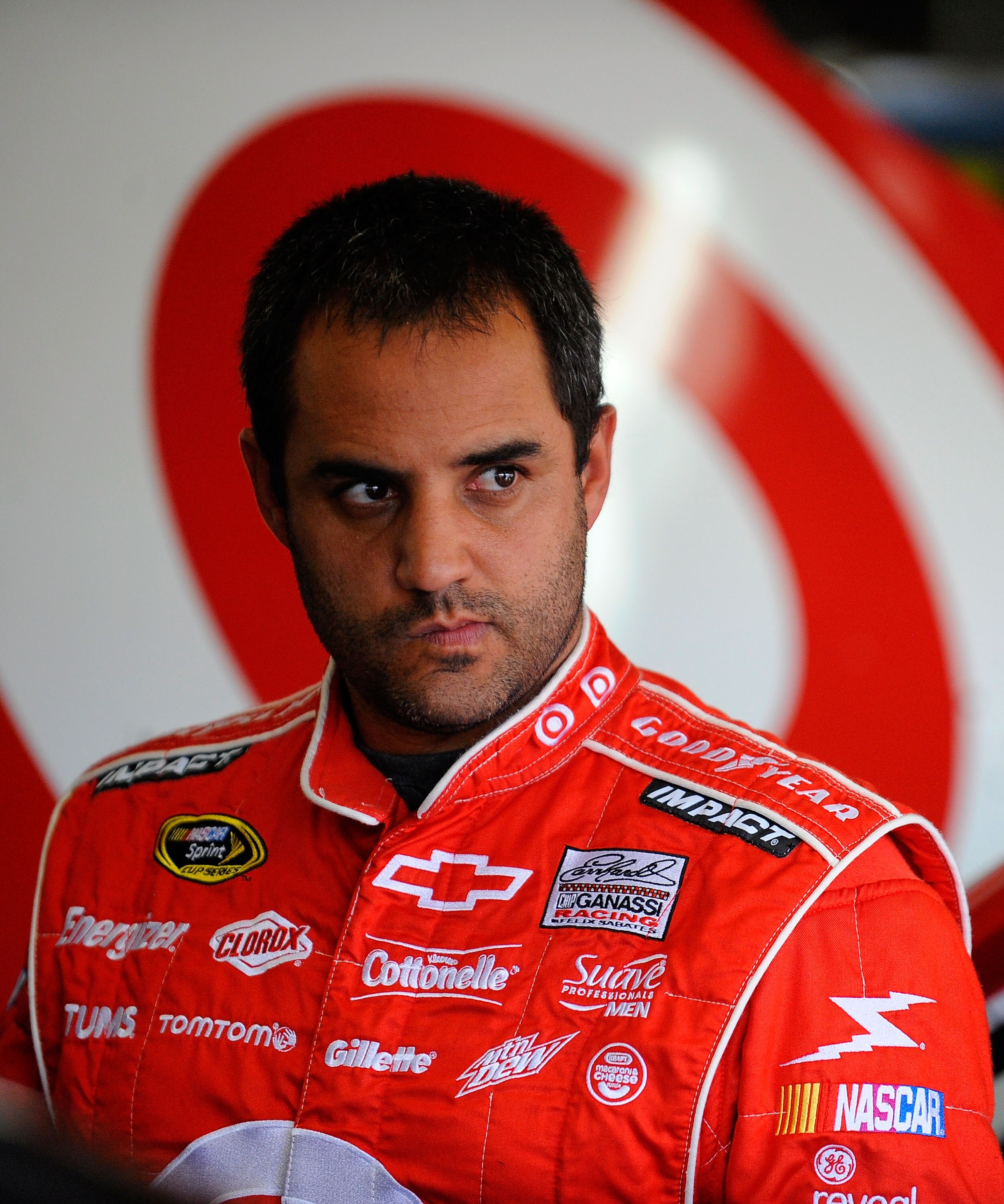 CHARLOTTE, NC - MAY 26:  Juan Pablo Montoya, driver of the #42 Target Chevrolet, stands in the garage during practice for the NASCAR Sprint Cup Series Coca-Cola 600 at Charlotte Motor Speedway on May 26, 2011 in Charlotte, North Carolina.  (Photo by Jared