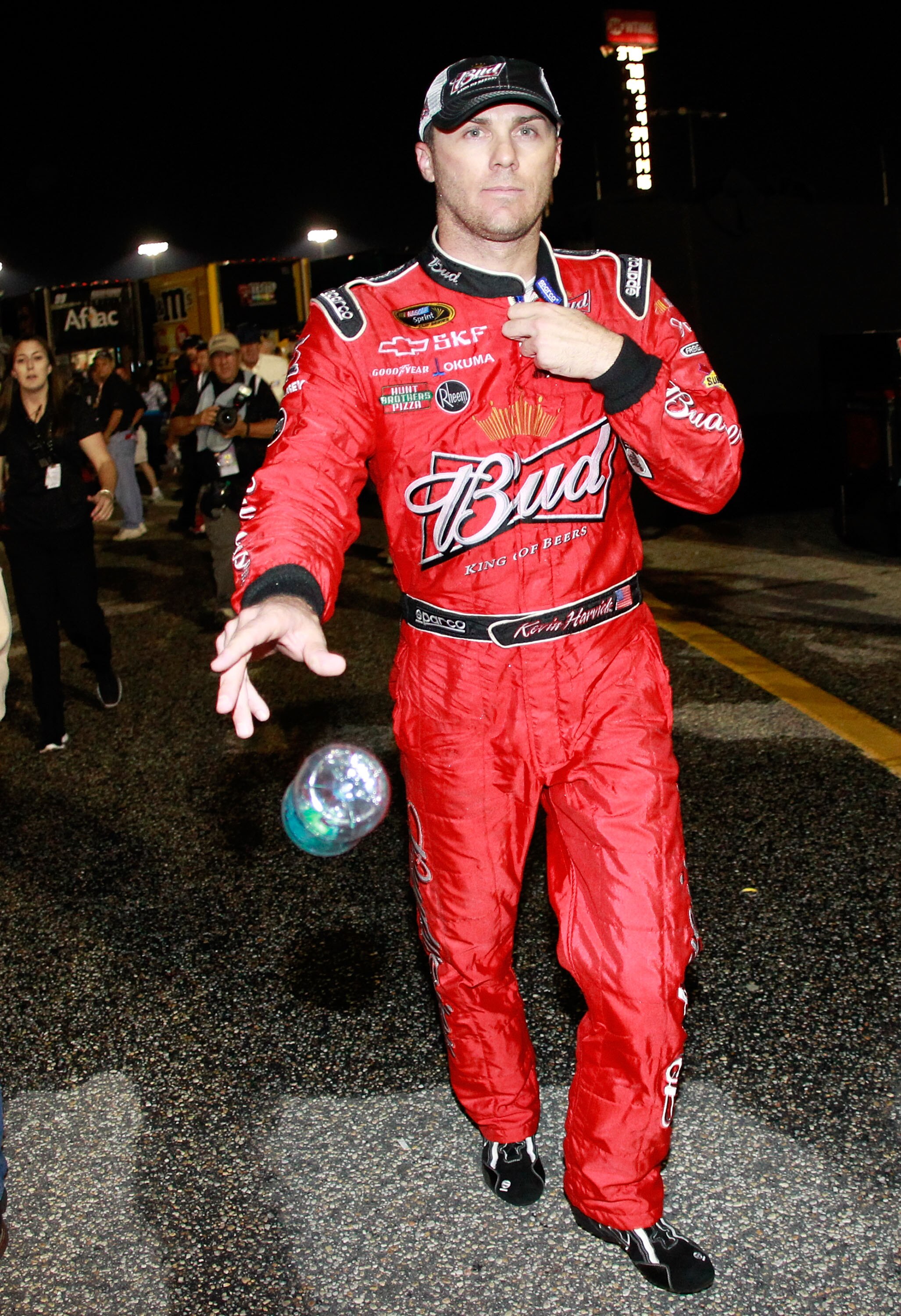 DARLINGTON, SC - MAY 07: Kevin Harvick, driver of the #29 Budweiser Chevrolet, throws a water bottle after having an argument with Kyle Busch, driver of the #18 Wrigley Doublemint Toyota, after the NASCAR Sprint Cup Series SHOWTIME Southern 500 at Darling