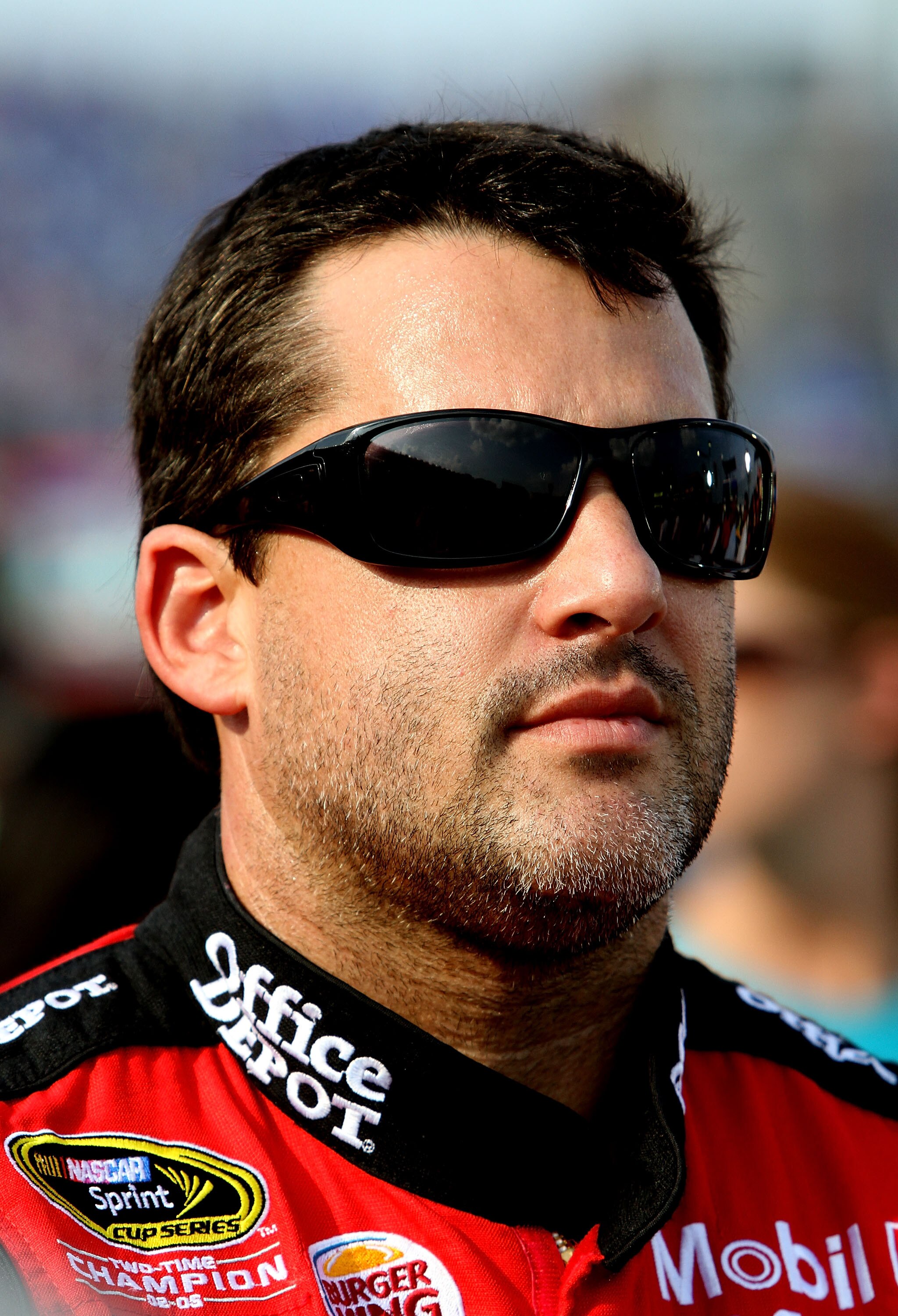 CONCORD, NC - MAY 29:  Tony Stewart, driver of the #14 Office Depot/Mobil 1 Chevrolet, stands on the grid prior to the NASCAR Sprint Cup Series Coca-Cola 600 at Charlotte Motor Speedway on May 29, 2011 in Concord, North Carolina.  (Photo by Jerry Markland