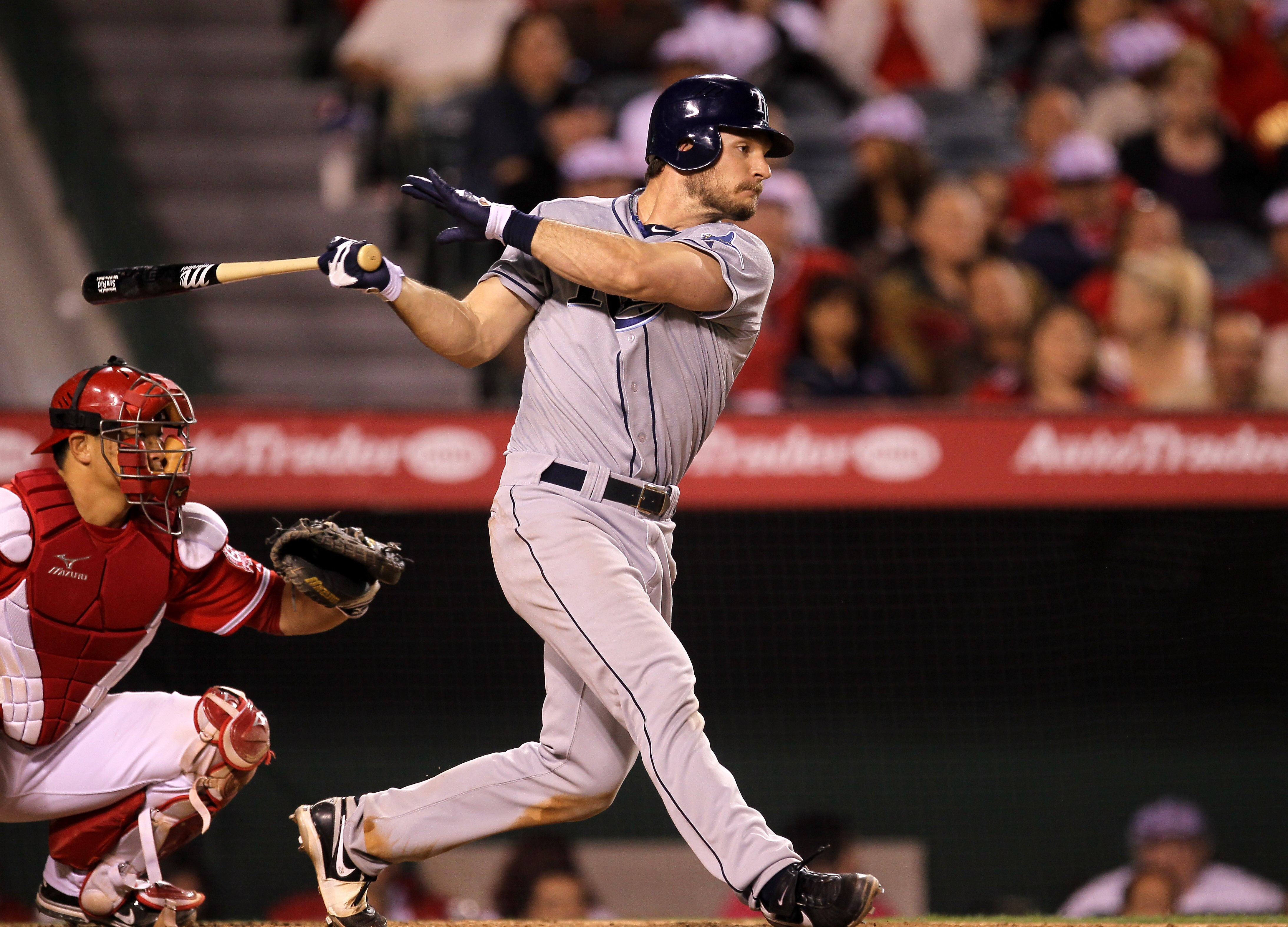 ANAHEIM, CA - JUNE 7: John Jaso #28 of the Tampa Bay Rays hits an RBI single in the eighth inning against the Los Angeles Angels of Anaheim on June 7, 2011 at Angel Stadium in Anaheim, California.  (Photo by Stephen Dunn/Getty Images)