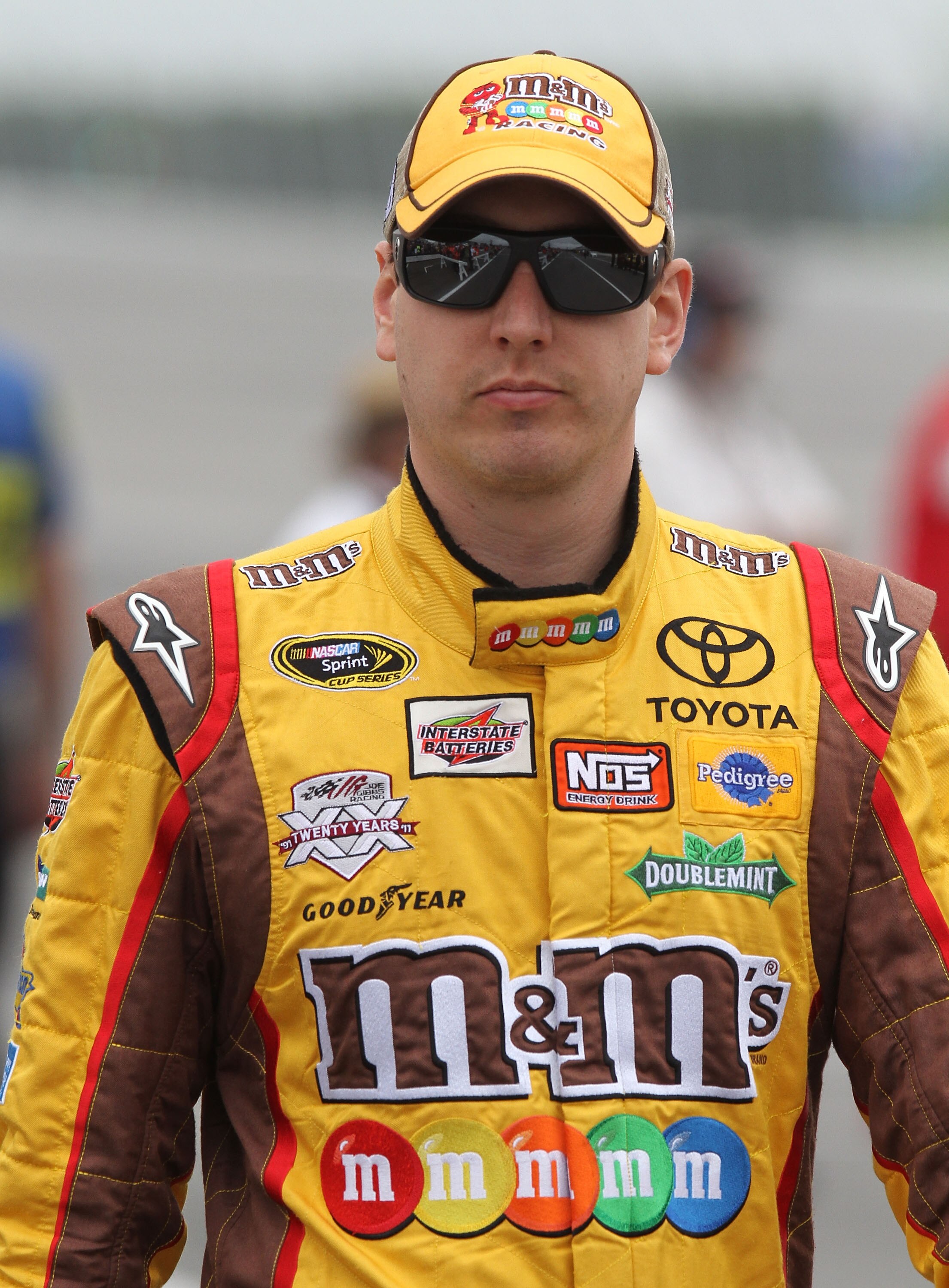 LONG POND, PA - JUNE 11:  Kyle Busch, driver of the #18 M&M's Toyota, looks on during qualifying for the NASCAR Sprint Cup Series 5-Hour Energy 500 at Pocono Raceway on June 11, 2011 in Long Pond, Pennsylvania.  (Photo by Jerry Markland/Getty Images for N