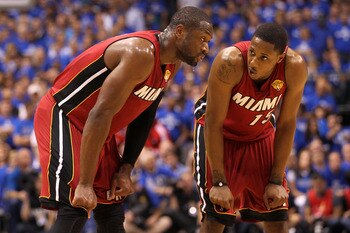 DALLAS, TX - JUNE 07:  Dwyane Wade #3 (L) and Mario Chalmers #15 of the Miami Heat talk on court against the Dallas Mavericks in Game Four of the 2011 NBA Finals at American Airlines Center on June 7, 2011 in Dallas, Texas. NOTE TO USER: User expressly ac