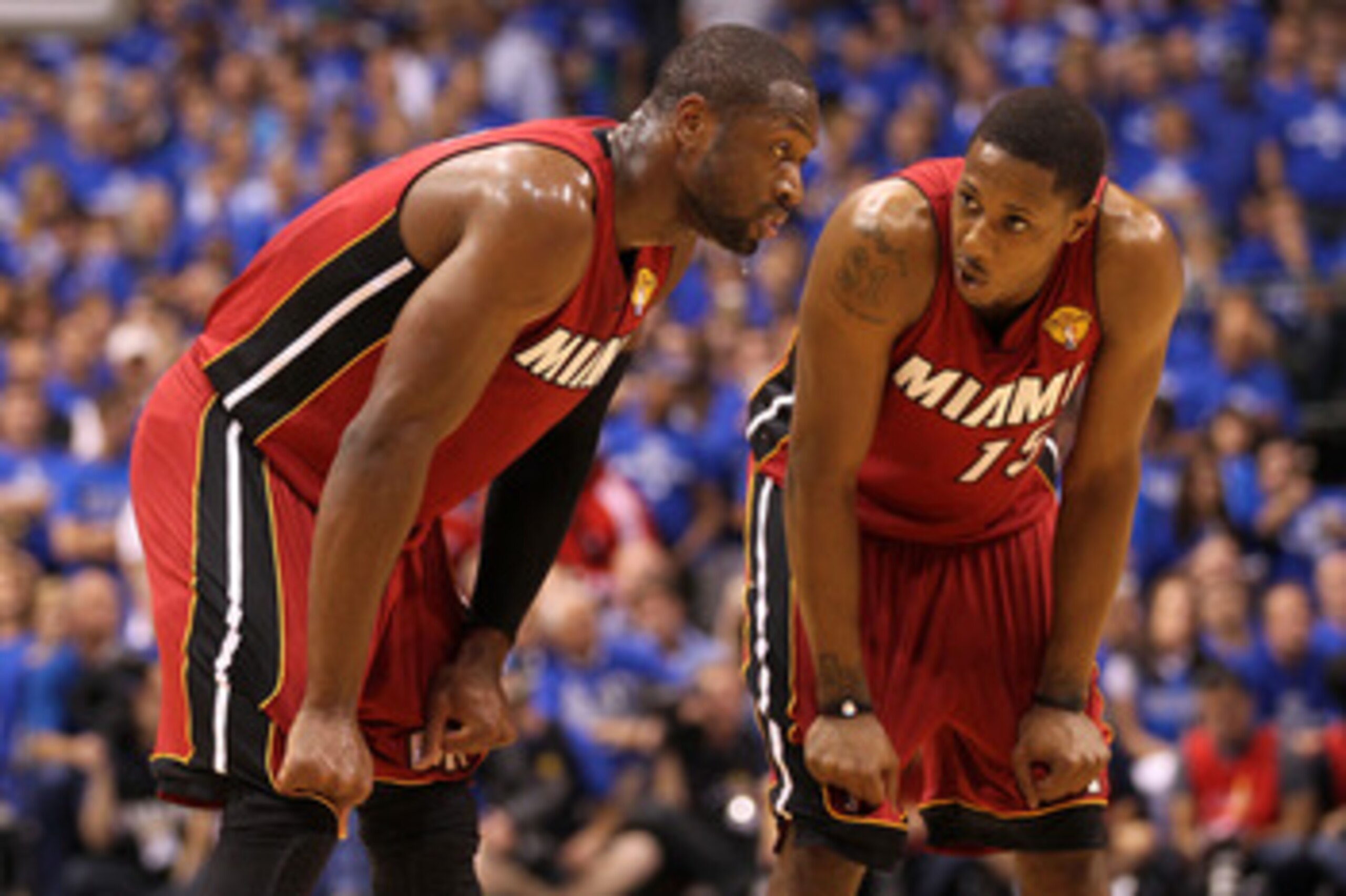DALLAS, TX - JUNE 07:  Dwyane Wade #3 (L) and Mario Chalmers #15 of the Miami Heat talk on court against the Dallas Mavericks in Game Four of the 2011 NBA Finals at American Airlines Center on June 7, 2011 in Dallas, Texas. NOTE TO USER: User expressly ac