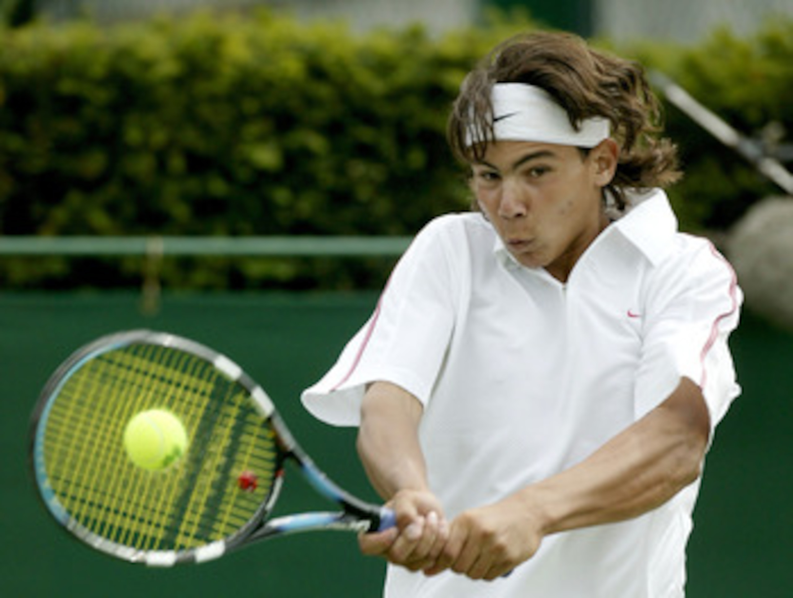 LONDON - JUNE 25:  Rafael Nadal of Spain in action on his way to winning his match against Lee Childs during day three of the Wimbledon Tennis Championships at the All England Lawn Tennis Club June 25, 2003 in London, England.  (Photo by Alex Livesey/Gett