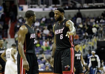 WASHINGTON, DC - MARCH 30:  Dwyane Wade #3 of the Miami Heat and LeBron James #6 talk during their game against the Washington Wizards at the Verizon Center on March 30, 2011 in Washington, DC. NOTE TO USER: User expressly acknowledges and agrees that, by