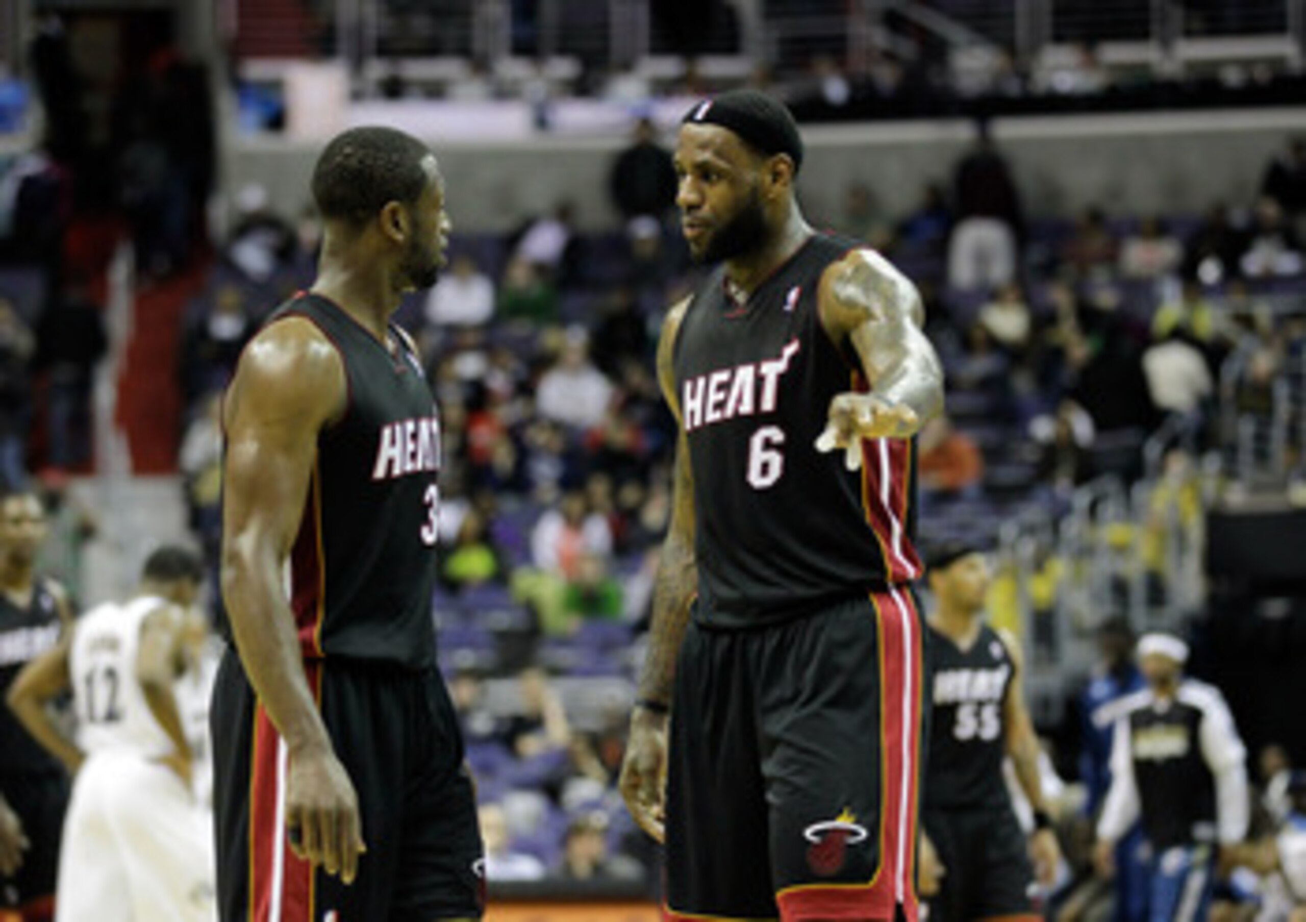 WASHINGTON, DC - MARCH 30:  Dwyane Wade #3 of the Miami Heat and LeBron James #6 talk during their game against the Washington Wizards at the Verizon Center on March 30, 2011 in Washington, DC. NOTE TO USER: User expressly acknowledges and agrees that, by