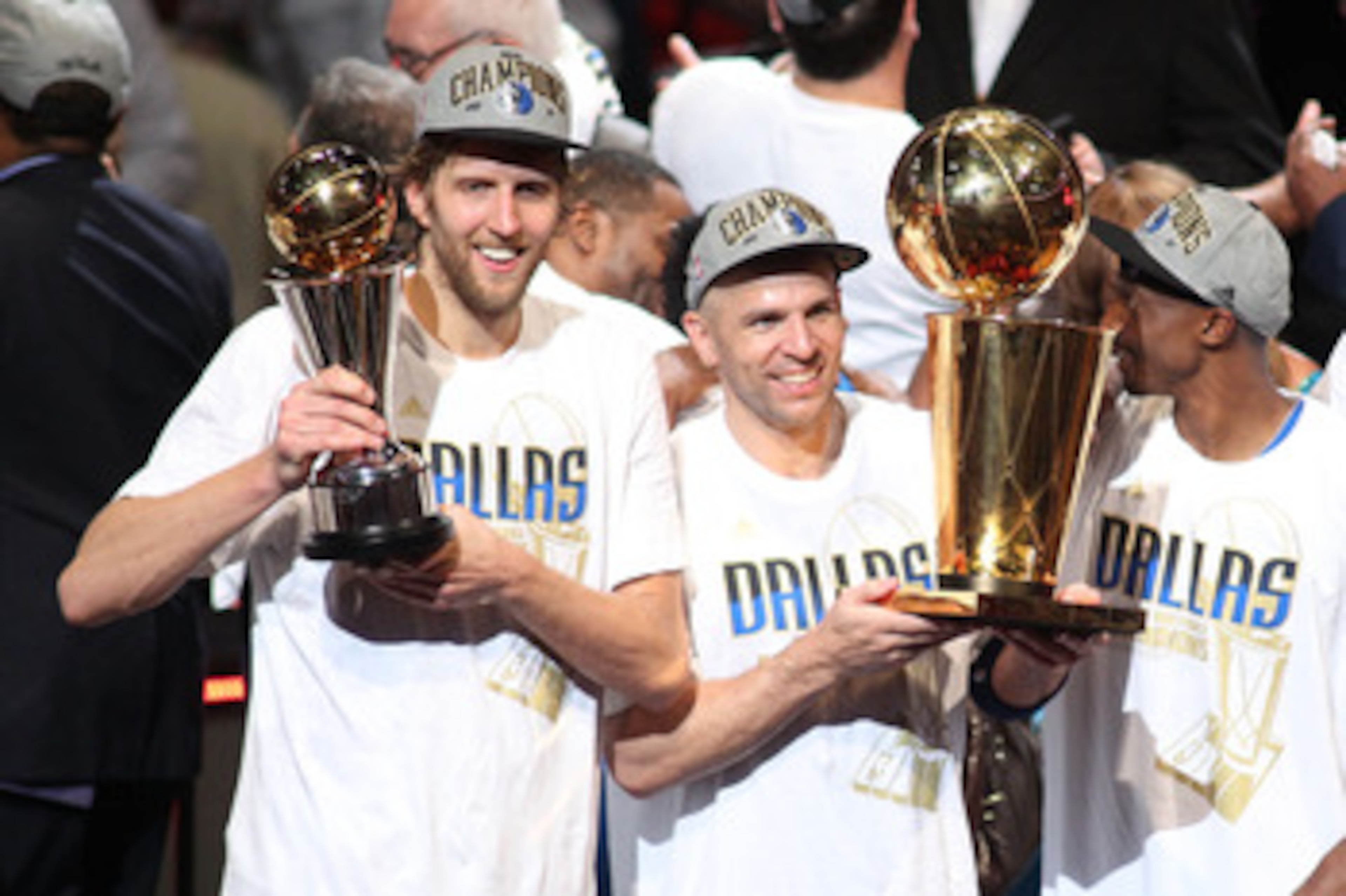 MIAMI, FL - JUNE 12:  (L-R) Finals MVP Dirk Nowitzki #41, Jason Kidd #2 and Jason Terry #31 of the Dallas Mavericks celebrate with the Larry O'Brien trophy after they won 105-95 against the Miami Heat in Game Six of the 2011 NBA Finals at American Airline