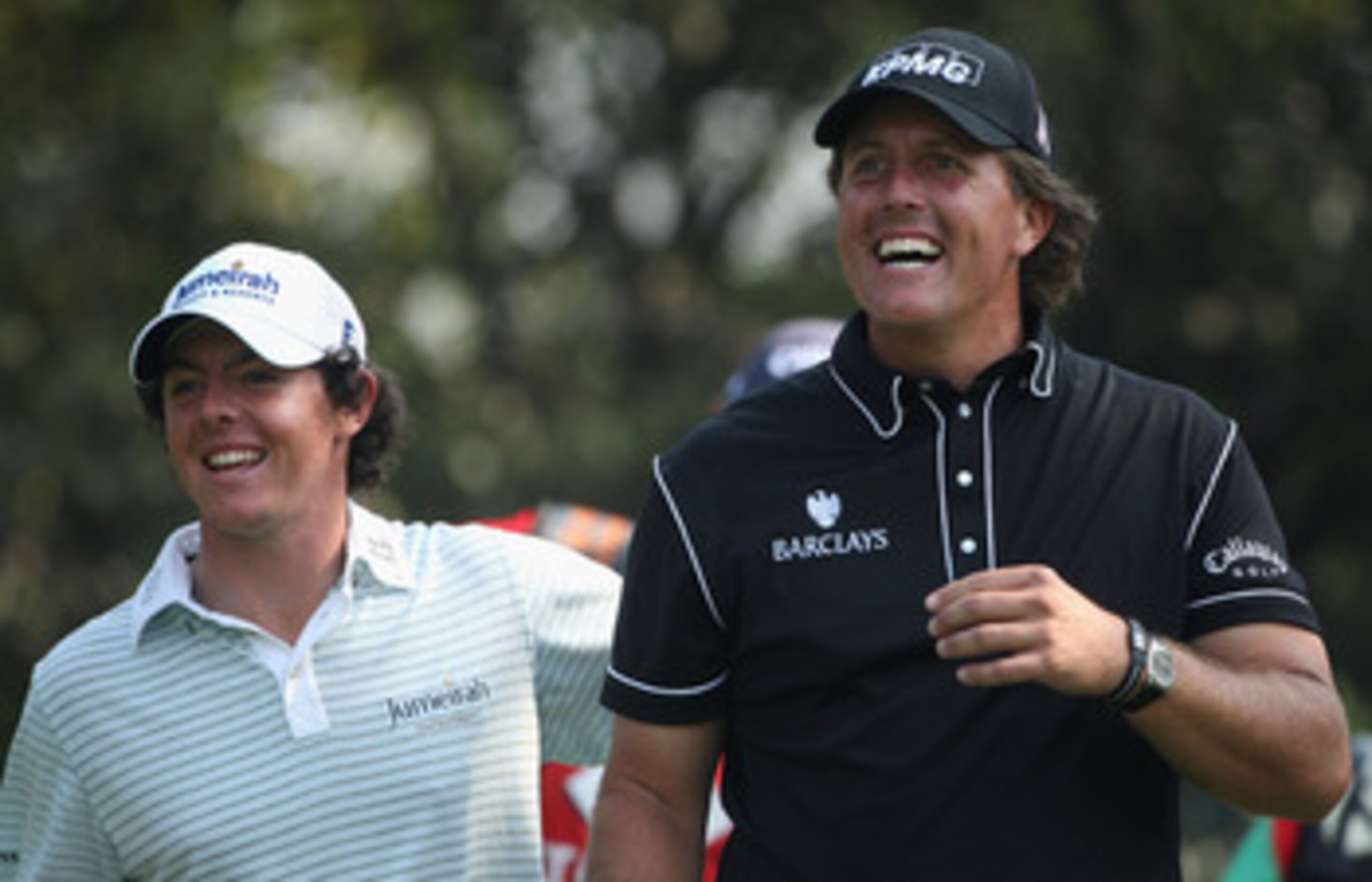 SHANGHAI, CHINA - NOVEMBER 06:  Phil Mickelson of the USA (right) and Rory McIlroy of Northern Ireland share a joke on the fifth hole during the second round of the WGC-HSBC Champions at Sheshan International Golf Club on November 6, 2009 in Shanghai, Chi