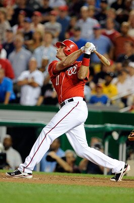 WASHINGTON - JULY 01:  Ryan Zimmerman #11 of the Washington Nationals hits a sacrifice fly to drive in the winning run in the ninth inning against the New York Mets at Nationals Park on July 1, 2010 in Washington, DC. The Nationals won the game 2-1.  (Pho