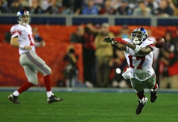 GLENDALE, AZ - FEBRUARY 03:  Plaxico Burress #17 of the New York Giants cannot catch up to a pass from Eli Manning #10 during Super Bowl XLII against the New England Patriots on February 3, 2008 at the University of Phoenix Stadium in Glendale, Arizona.  