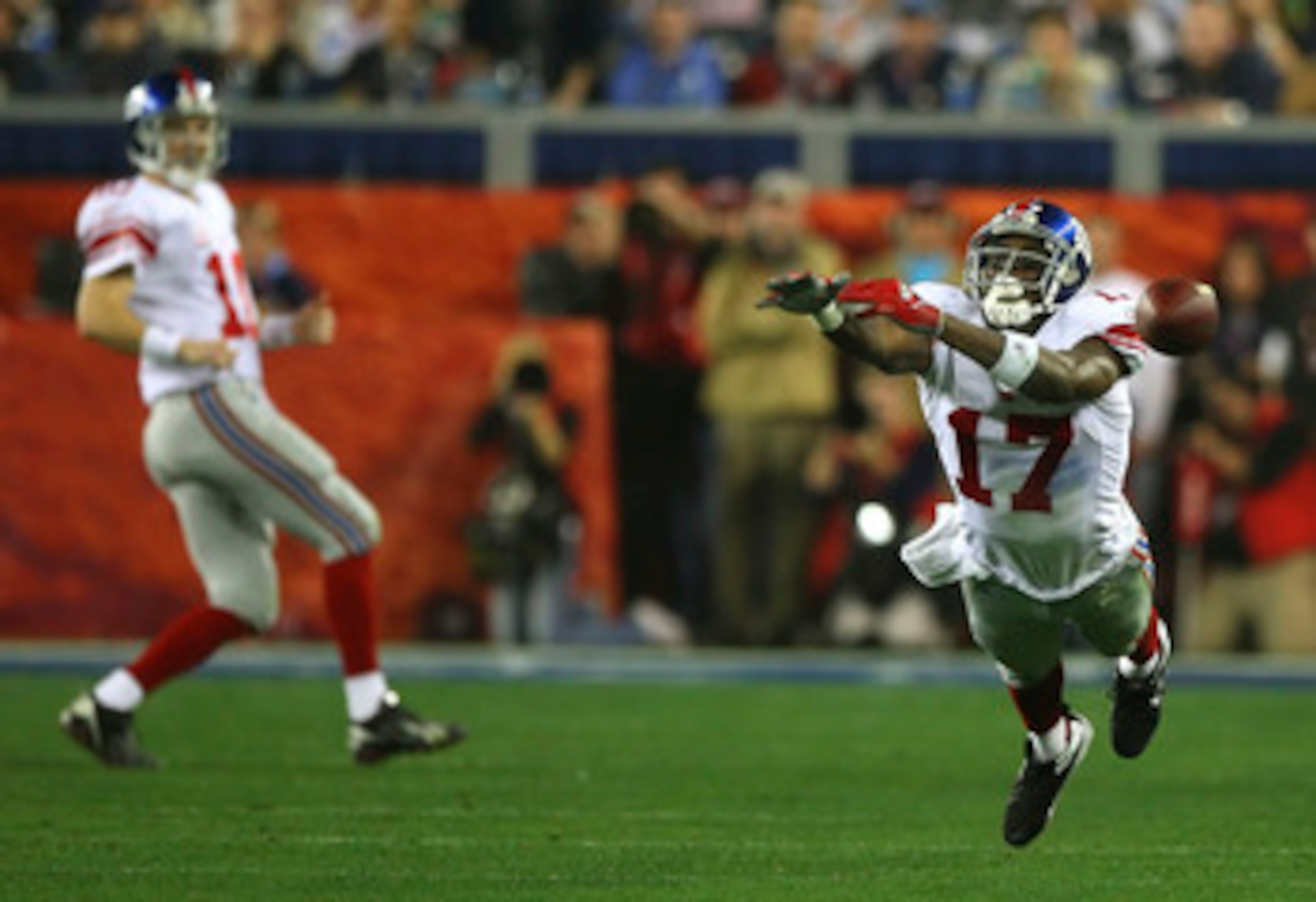 GLENDALE, AZ - FEBRUARY 03:  Plaxico Burress #17 of the New York Giants cannot catch up to a pass from Eli Manning #10 during Super Bowl XLII against the New England Patriots on February 3, 2008 at the University of Phoenix Stadium in Glendale, Arizona.  
