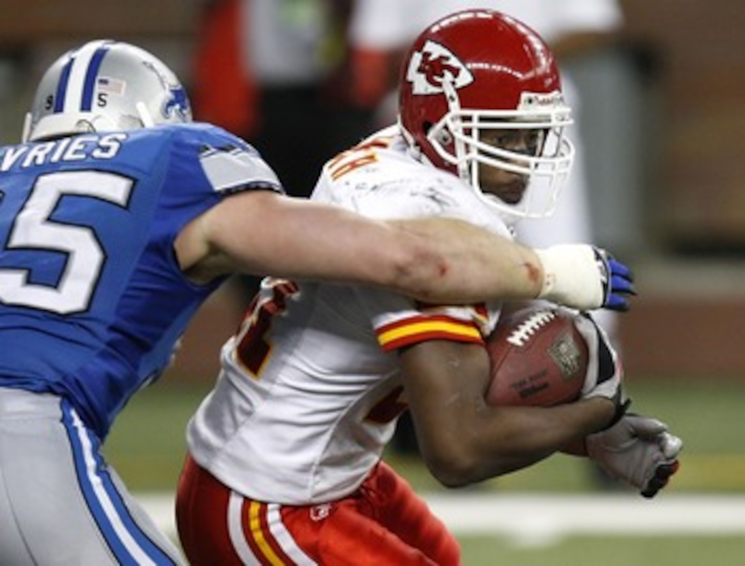DETROIT - DECEMBER 23:  Kolby Smith #21 of the Kansas City Chiefs tries to get around the tackle of Jared Devries #95 of the Detroit Lions on December 23, 2007 at Ford Field in Detroit, Michigan. (Photo By Gregory Shamus/Getty Images)