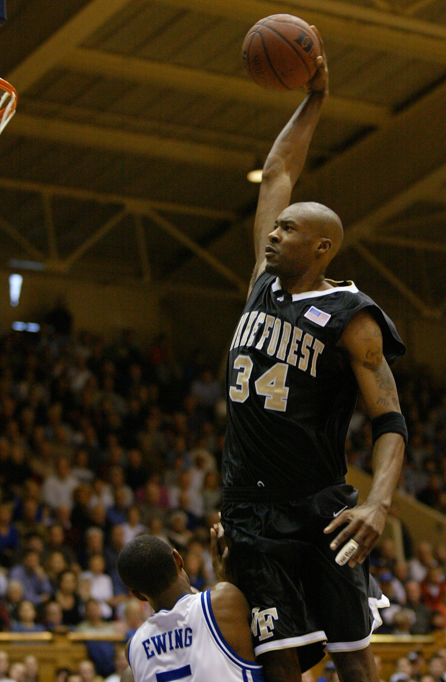 19 Jan 2002:  Antwan Scott #34 of Wake Forest dunks over Daniel Ewing #5 during the first half of the Wake Forest Demon Deacons v Duke Blue Devils game at Cameron Indoor Stadium in Durham, North Carolina.  Digital Image. Mandatory Credit: Craig Jones/Gett