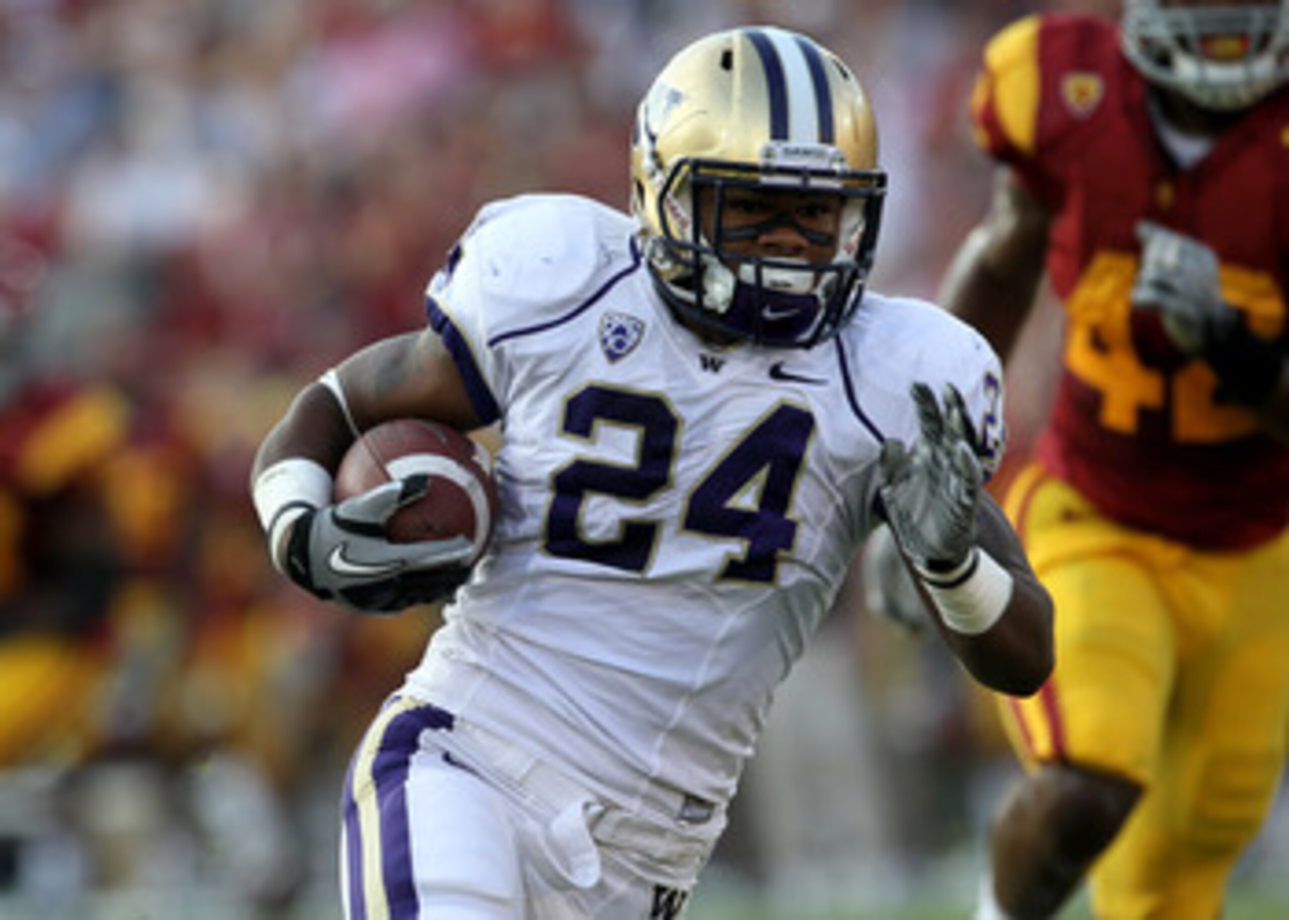 LOS ANGELES - OCTOBER 2:  Running back Jesse Callier #24 of the Washington Huskies carries the ball against the USC Trojans at the Los Angeles Memorial Coliseum on October 2, 2010 in Los Angeles, California.    (Photo by Stephen Dunn/Getty Images)