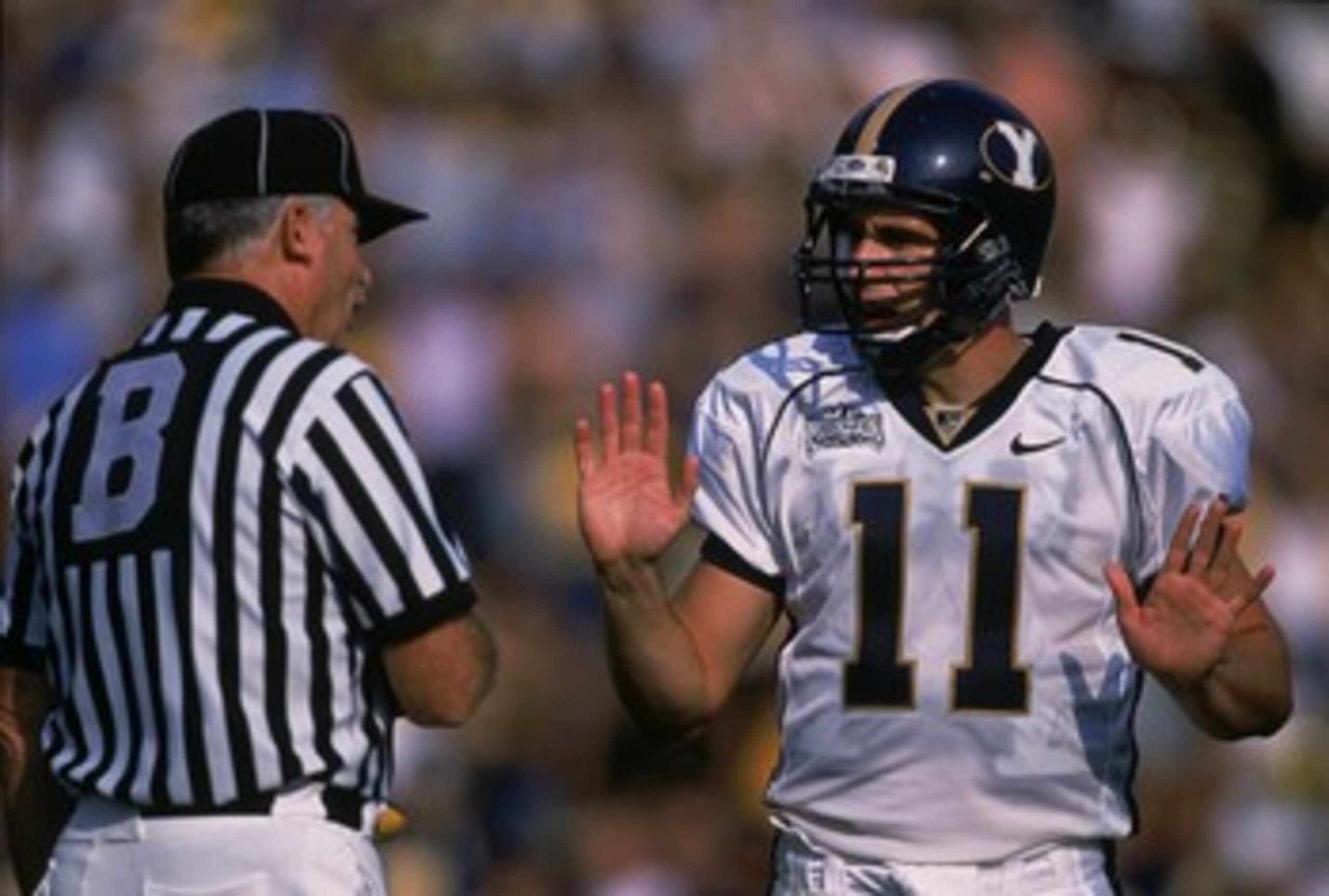 8 Sep 2001:  Quarterback Brandon Doman #11 of the Brigham Young Cougars talking with the referee during the game against the California Bears at Memorial Stadium in Berkeley, California. The Cougars defeated the Bears 44-16.Mandatory Credit: Jed Jacobsohn