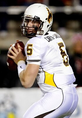 LAS VEGAS - NOVEMBER 13:  Quarterback Austyn Carta-Samuels #5 of the Wyoming Cowboys looks to pass during a game against the UNLV Rebels at Sam Boyd Stadium November 13, 2010 in Las Vegas, Nevada. UNLV won 42-16.  (Photo by Ethan Miller/Getty Images)