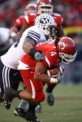 SALT LAKE CITY - NOVEMBER 22:  Matt Asiata #4 of the Utah Utes runs with the ball against the BYU Cougars at Rice-Eccles Stadium on November 22, 2008 in Salt Lake City, Utah.  (Photo by Jonathan Ferrey/Getty Images)