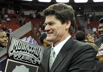 LAS VEGAS - MARCH 13:  Mountain West Conference Commissioner Craig Thompson presents the trophy to Kelvin Davis #40 of the San Diego State Aztecs after they beat the UNLV Rebels 55-45 in the championship game of the Conoco Mountain West Conference Basketb
