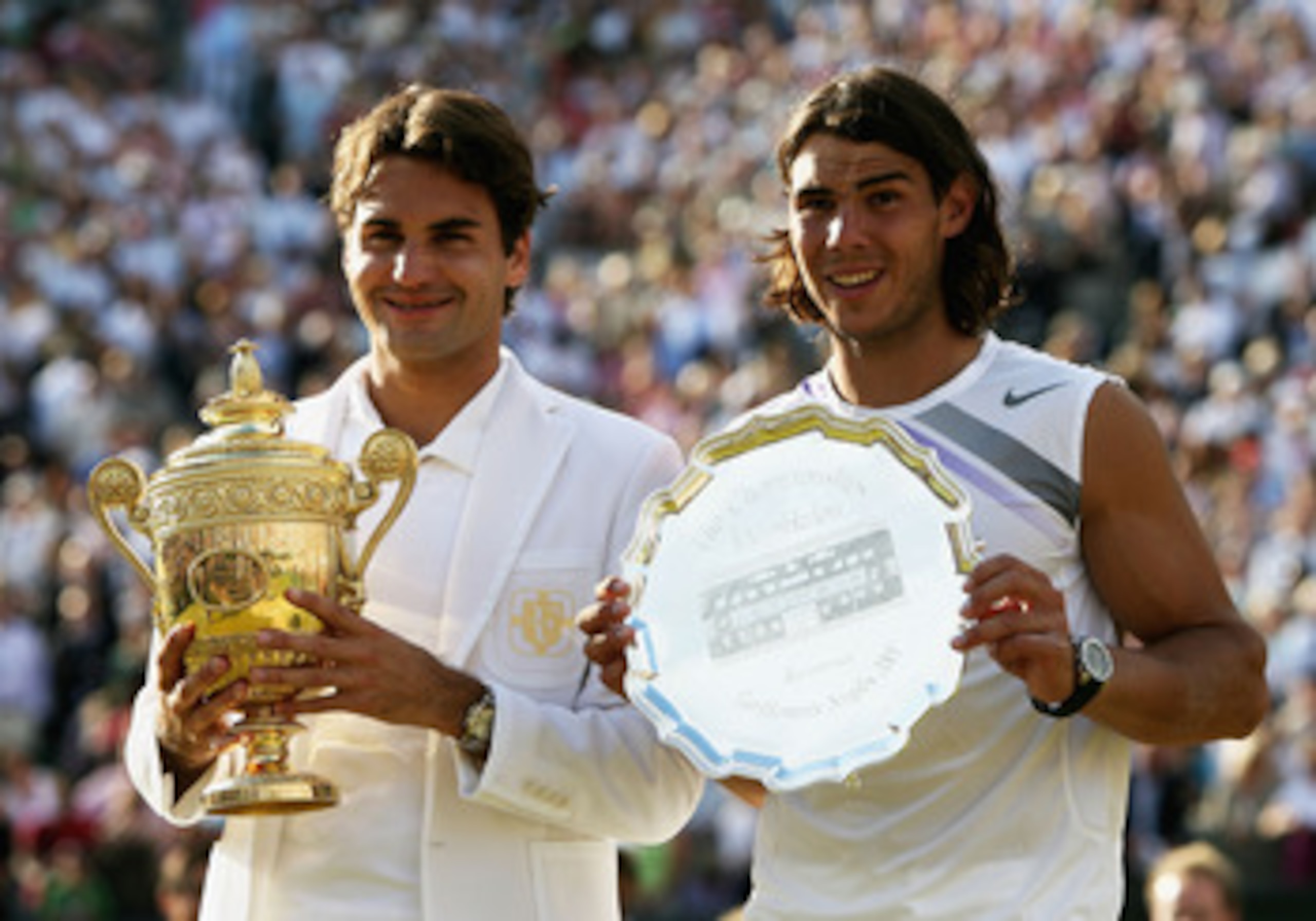 LONDON - JULY 08:  Roger Federer of Switzerland poses with the winners trophy alongside runner-up Rafael Nadal of Spain following the Men's Singles final match during day thirteen of the Wimbledon Lawn Tennis Championships at the All England Lawn Tennis a