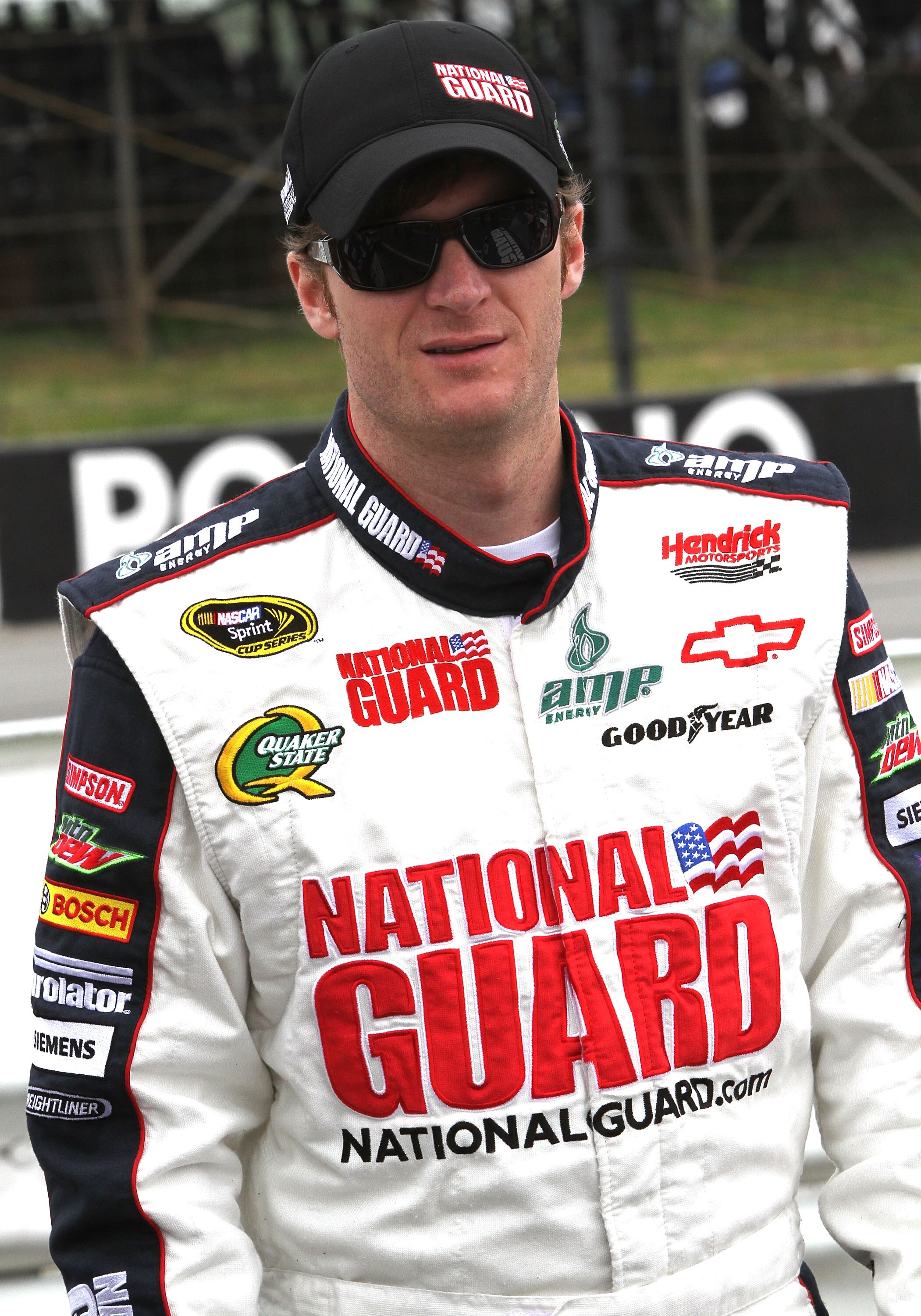 LONG POND, PA - JUNE 12:  Dale Earnhardt Jr., driver of the #88 National Guard/Amp Energy Chevrolet, stands on the grid prior to the NASCAR Sprint Cup Series 5-Hour Energy 500 at Pocono Raceway on June 12, 2011 in Long Pond, Pennsylvania.  (Photo by Jerry