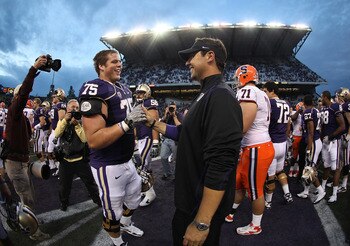 SEATTLE - SEPTEMBER 11:  Head coach Steve Sarkisian of the Washington Huskies is congratulated by Erik Kohler #75 after the Huskies defeated the Orange 41-20 on September 11, 2010 at Husky Stadium in Seattle, Washington. (Photo by Otto Greule Jr/Getty Ima