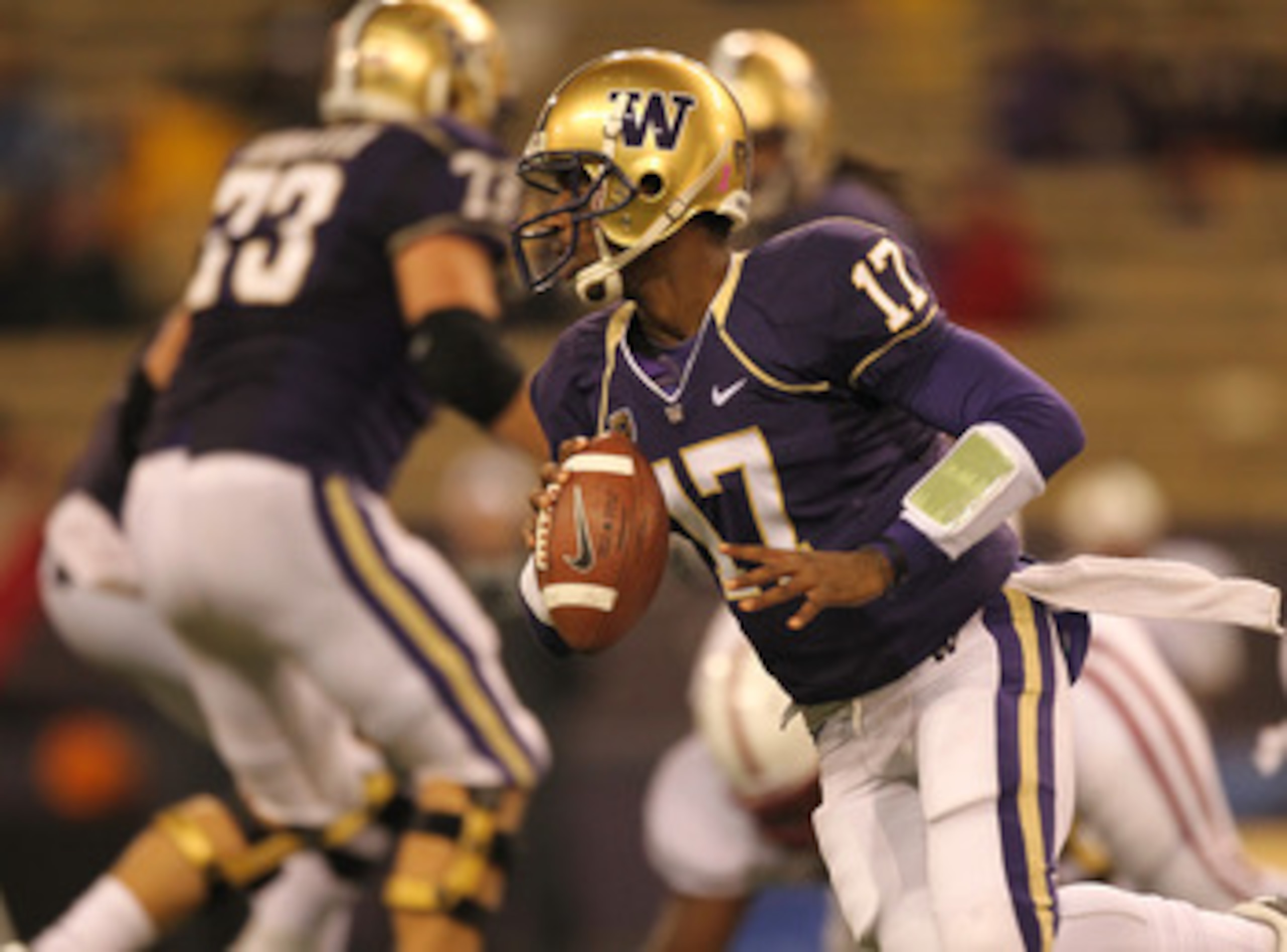 SEATTLE - OCTOBER 30:  Quarterback Keith Price #17 of the Washington Huskies rolls out against the Stanford Cardinal on October 30, 2010 at Husky Stadium in Seattle, Washington. Stanford won 41-0. (Photo by Otto Greule Jr/Getty Images)