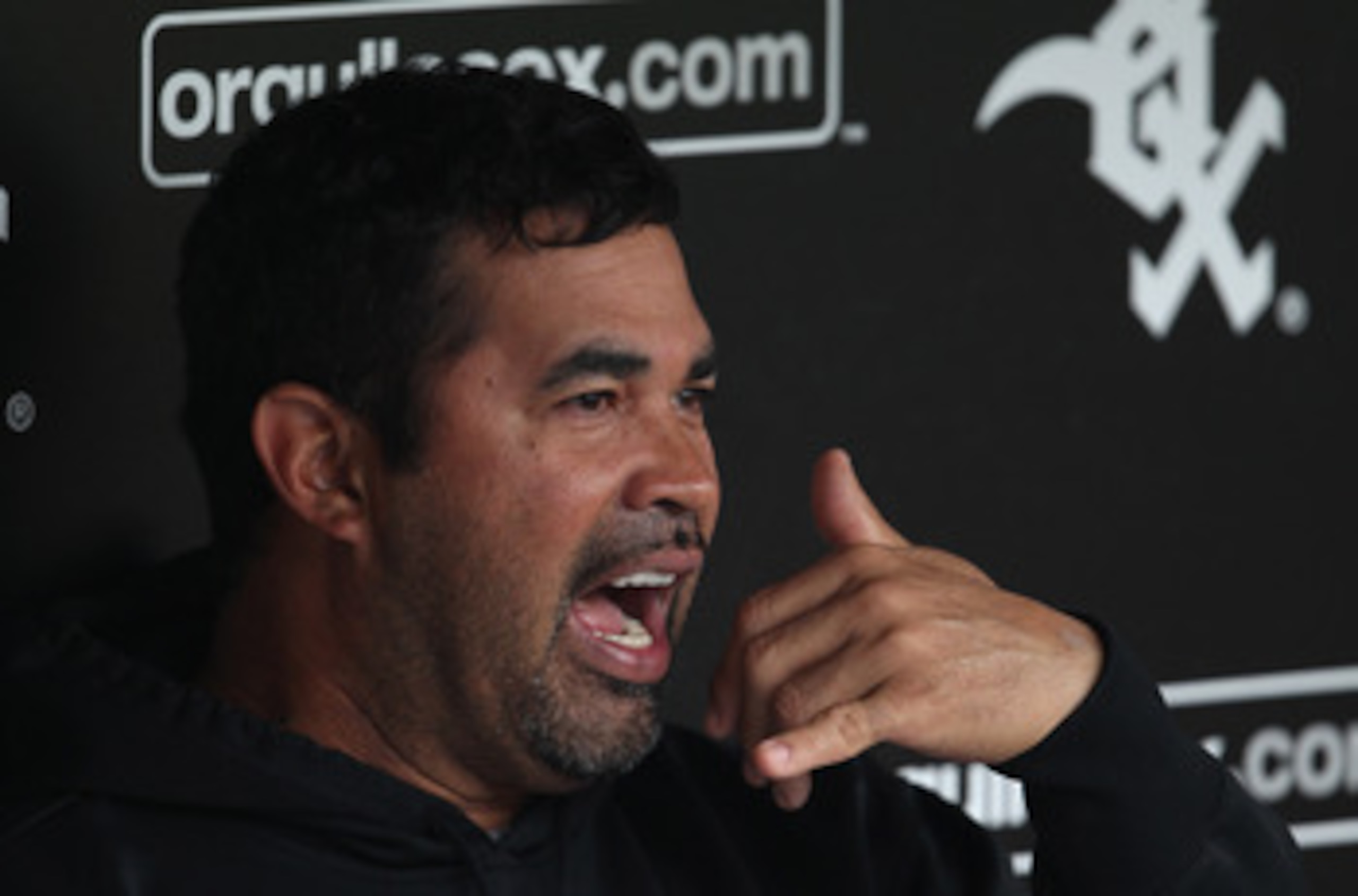 CHICAGO, IL - JUNE 09: Manager Ozzie Guillen #13 of the Chicago White Sox talks with reporters before a game against the Oakland Athletics at U.S. Cellular Field on June 9, 2011 in Chicago, Illinois. (Photo by Jonathan Daniel/Getty Images) CHICAGO, IL - JUNE 09: Manager Ozzie Guillen #13 of the Chicago White Sox talks with reporters before a game against the Oakland Athletics at U.S. Cellular Field on June 9, 2011 in Chicago, Illinois. (Photo by Jonathan Daniel/Getty Images)