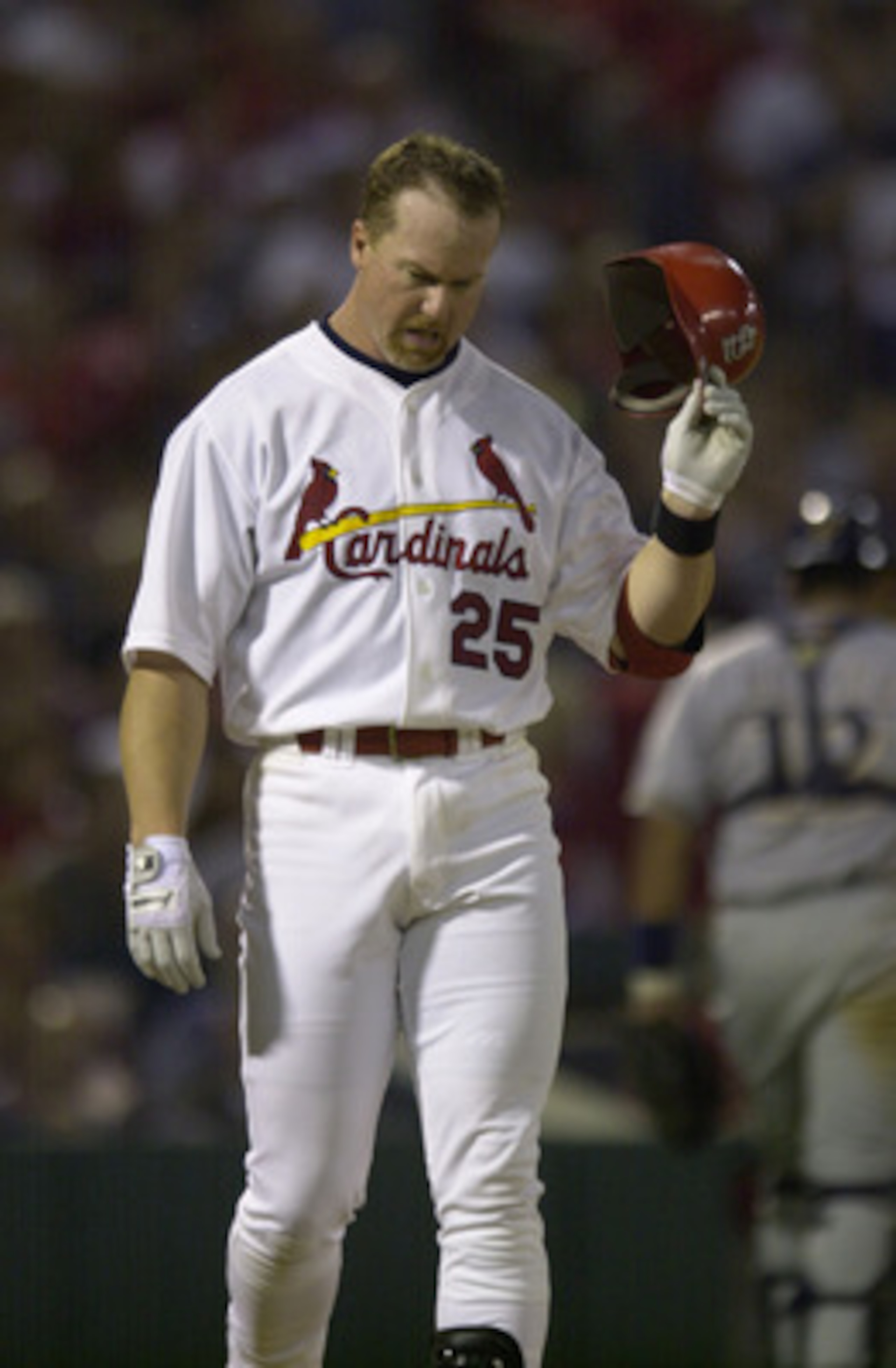 17 Sept 2001: First baseman Mark McGwire #25 throws his helmet during the game between the Cardinals and the Brewers at Busch stadium in St. Louis, Missouri. The Cardinals defeated the Brewers 2-1. DIGITAL IMAGE. Mandatory Credit: Elsa/ALLSPORT 17 Sept 2001: First baseman Mark McGwire #25 throws his helmet during the game between the Cardinals and the Brewers at Busch stadium in St. Louis, Missouri. The Cardinals defeated the Brewers 2-1. DIGITAL IMAGE. Mandatory Credit: Elsa/ALLSPORT