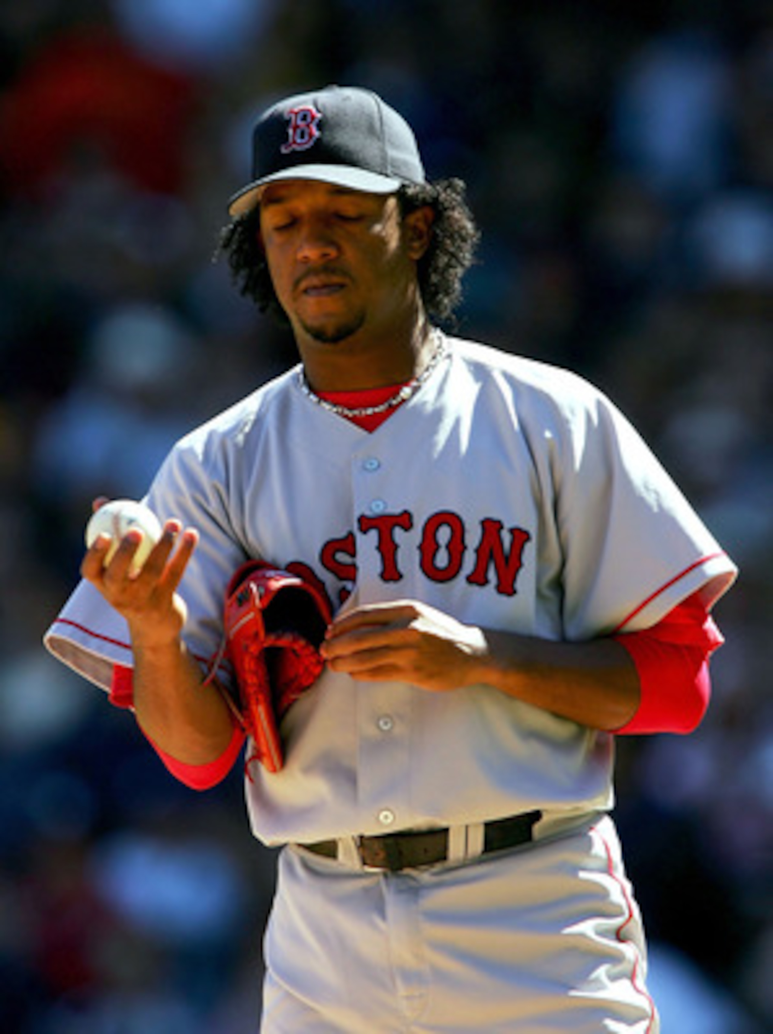 NEW YORK - SEPTEMBER 19: Starting pictcher Pedro Martinez #45 of the Boston Red Sox closes his eyes after giving up a home run to Derek Jeter #2 the New York Yankees in the third inning on September 19, 2004 at Yankee Stadium in the Bronx, New York. The NEW YORK - SEPTEMBER 19: Starting pictcher Pedro Martinez #45 of the Boston Red Sox closes his eyes after giving up a home run to Derek Jeter #2 the New York Yankees in the third inning on September 19, 2004 at Yankee Stadium in the Bronx, New York. The