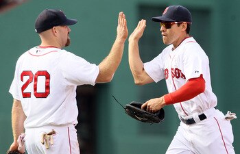 BOSTON, MA - MAY 08:  Kevin Youkilis #20 and Jacoby Ellsbury #2 of the Boston Red Sox celebrate the win over the Minnesota Twins on May 8, 2011 at Fenway Park in Boston, Massachusetts. The Boston Red Sox defeated the Minnesota Twins 9-5.  (Photo by Elsa/G