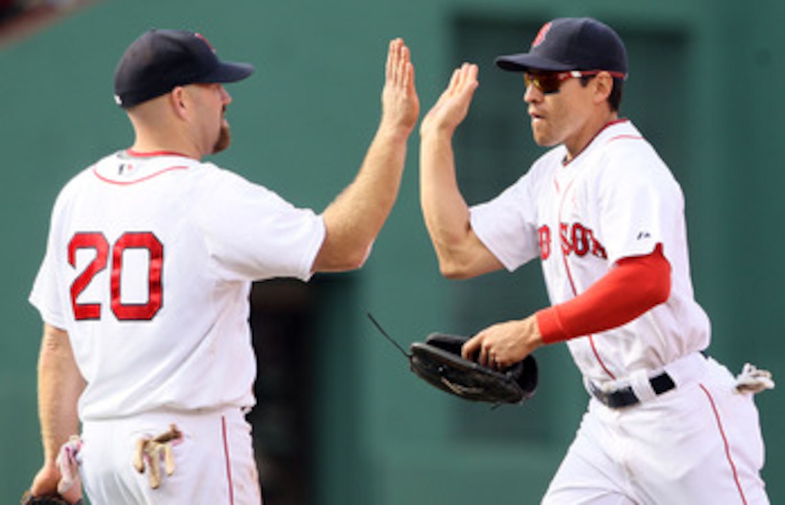 BOSTON, MA - MAY 08: Kevin Youkilis #20 and Jacoby Ellsbury #2 of the Boston Red Sox celebrate the win over the Minnesota Twins on May 8, 2011 at Fenway Park in Boston, Massachusetts. The Boston Red Sox defeated the Minnesota Twins 9-5. (Photo by Elsa/G BOSTON, MA - MAY 08: Kevin Youkilis #20 and Jacoby Ellsbury #2 of the Boston Red Sox celebrate the win over the Minnesota Twins on May 8, 2011 at Fenway Park in Boston, Massachusetts. The Boston Red Sox defeated the Minnesota Twins 9-5. (Photo by Elsa/G