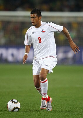 JOHANNESBURG, SOUTH AFRICA - JUNE 28:  Arturo Vidal of Chile runs with the ball during the 2010 FIFA World Cup South Africa Round of Sixteen match between Brazil and Chile at Ellis Park Stadium on June 28, 2010 in Johannesburg, South Africa.  (Photo by Ri