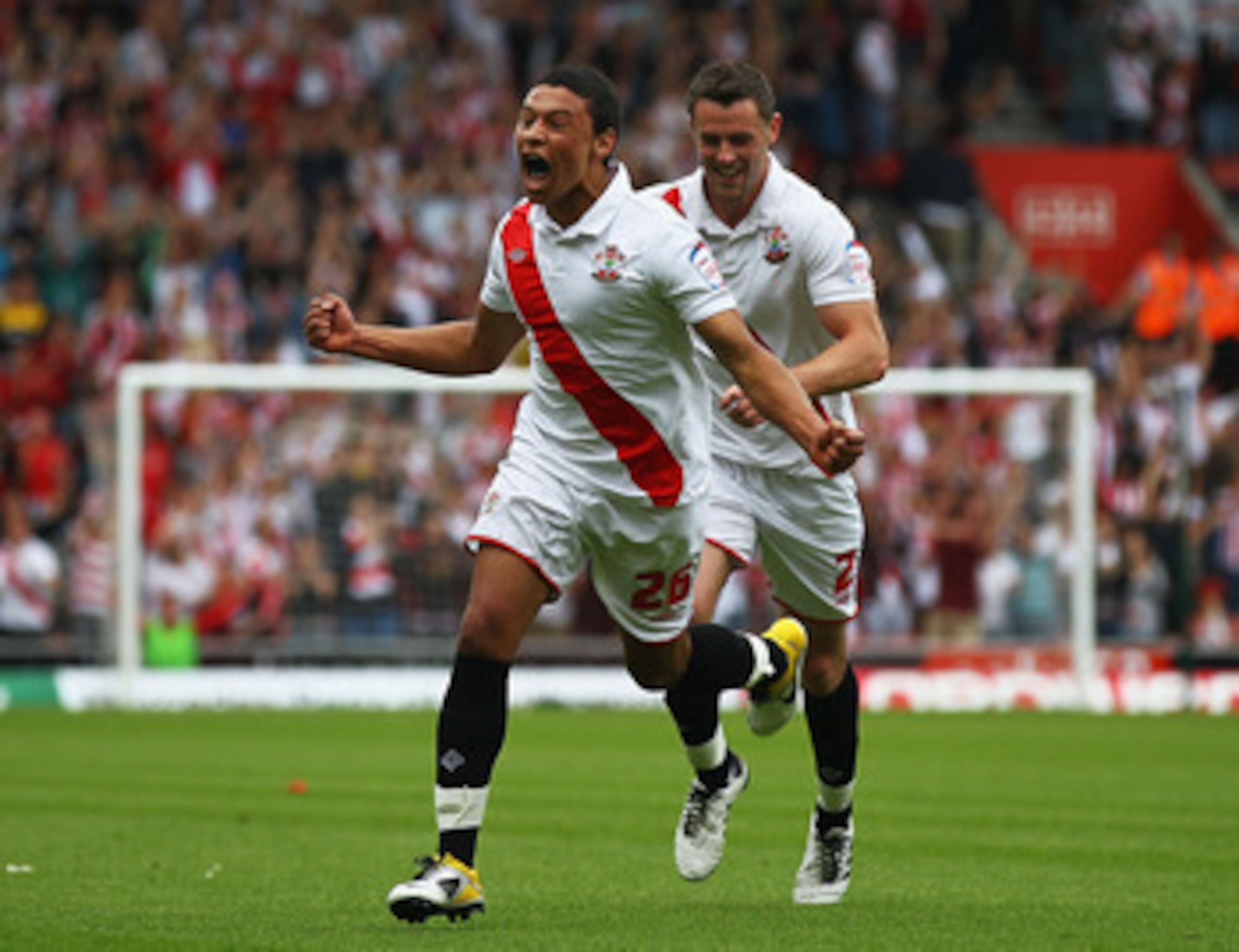 SOUTHAMPTON, ENGLAND - MAY 07:  Alex Chamberlain (L) of Southampton celebrates his goal with team mate Frazer Richardson during the npower League One match between Southampton and Walsall at St Mary's Stadium on May 7, 2011 in Southampton, England.  (Phot