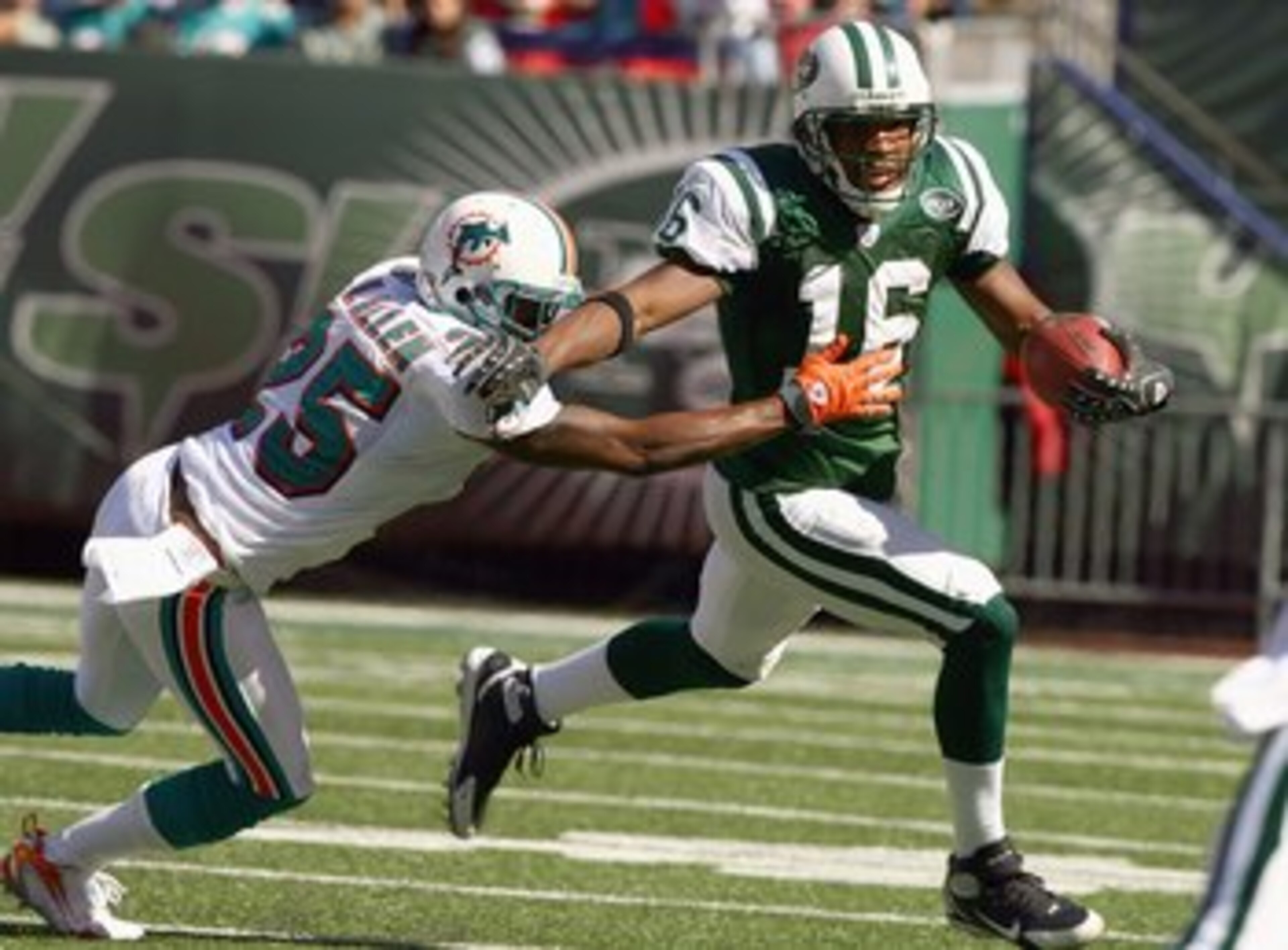 EAST RUTHERFORD, NJ - SEPTEMBER 23: Brad Smith #16 of the New York Jets runs with the ball against Will Allen #25 of the Miami Dolphins during their game on September 23, 2007 at Giants Stadium in East Rutherford, New Jersey. The Jets defeated the Dolphin
