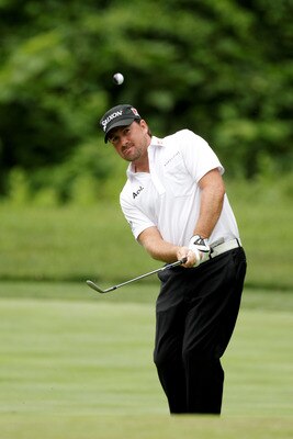 BETHESDA, MD - JUNE 14:  Graeme McDowell of Northern Ireland plays a pitch shot during a practice round prior to the start of the 111th U.S. Open at Congressional Country Club on June 14, 2011 in Bethesda, Maryland.  (Photo by Ross Kinnaird/Getty Images)