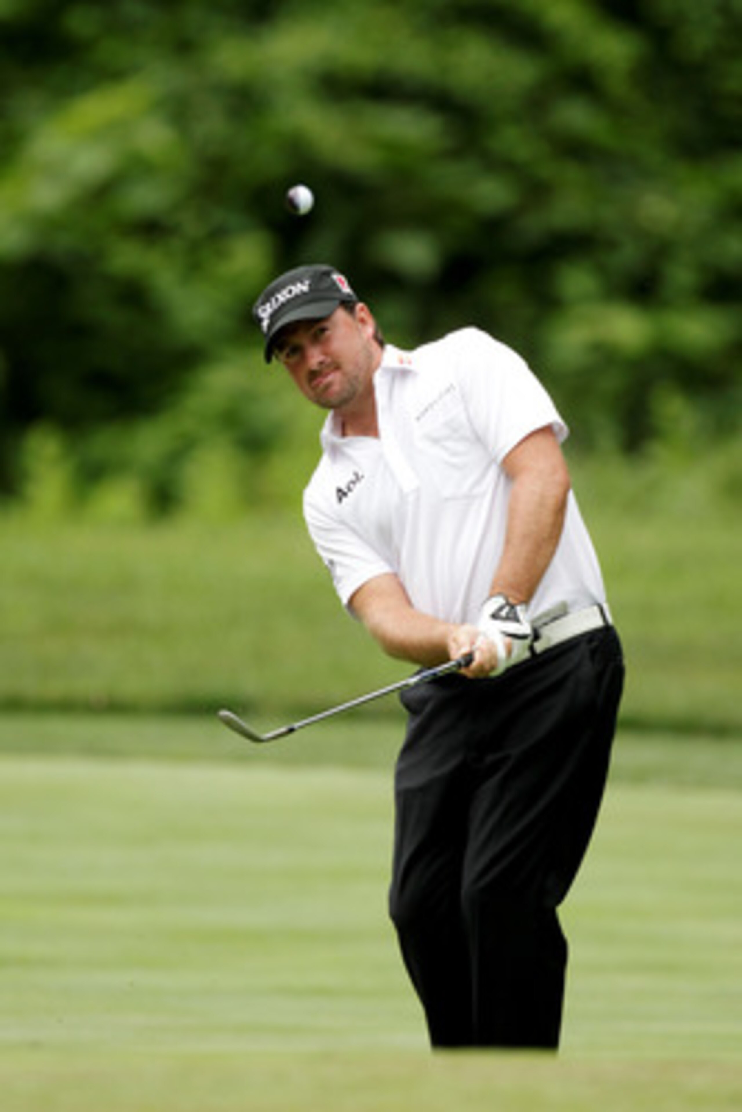 BETHESDA, MD - JUNE 14: Graeme McDowell of Northern Ireland plays a pitch shot during a practice round prior to the start of the 111th U.S. Open at Congressional Country Club on June 14, 2011 in Bethesda, Maryland. (Photo by Ross Kinnaird/Getty Images) BETHESDA, MD - JUNE 14: Graeme McDowell of Northern Ireland plays a pitch shot during a practice round prior to the start of the 111th U.S. Open at Congressional Country Club on June 14, 2011 in Bethesda, Maryland. (Photo by Ross Kinnaird/Getty Images)